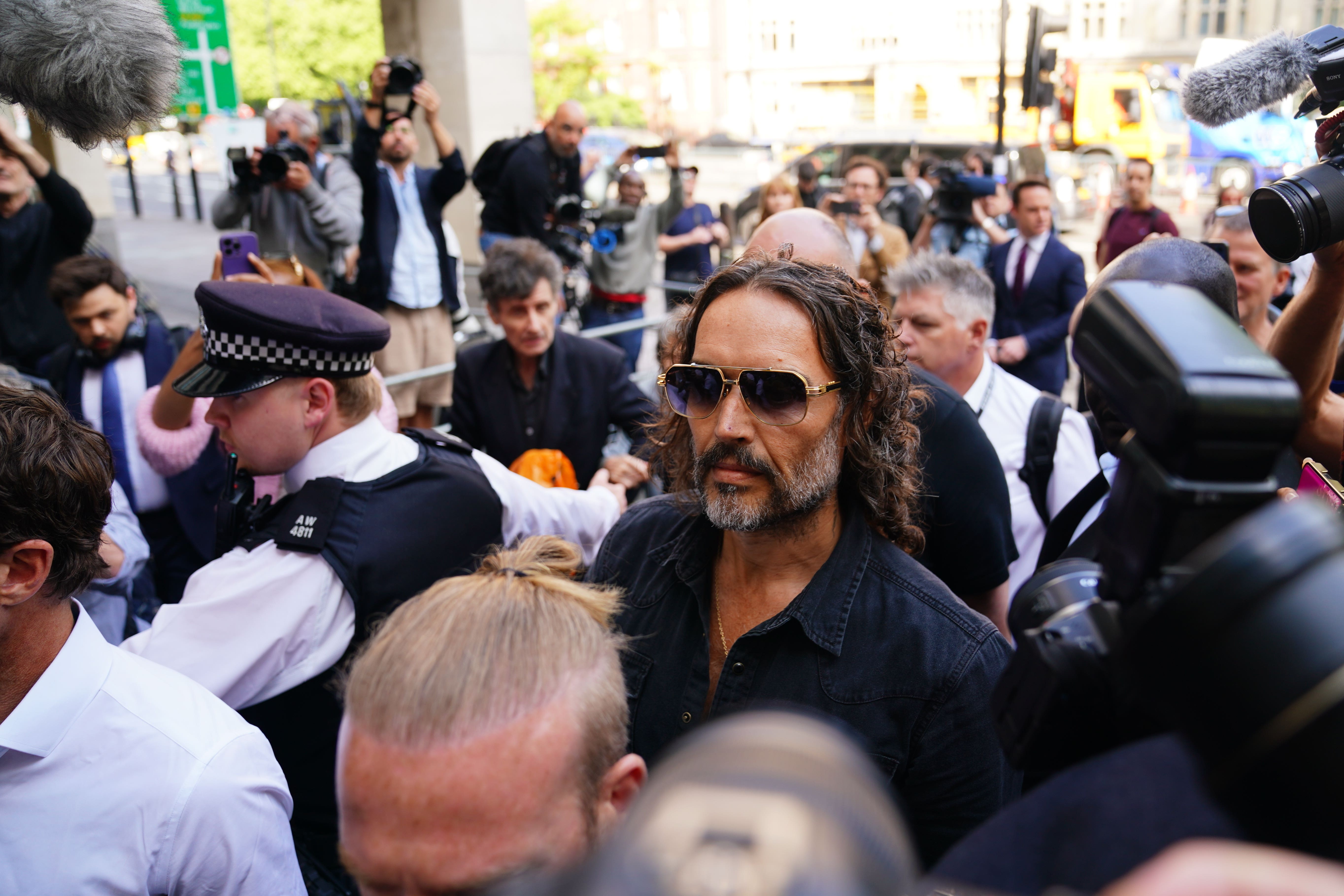 Russell Brand arriving at Westminster Magistrates’ Court (James Manning/PA)