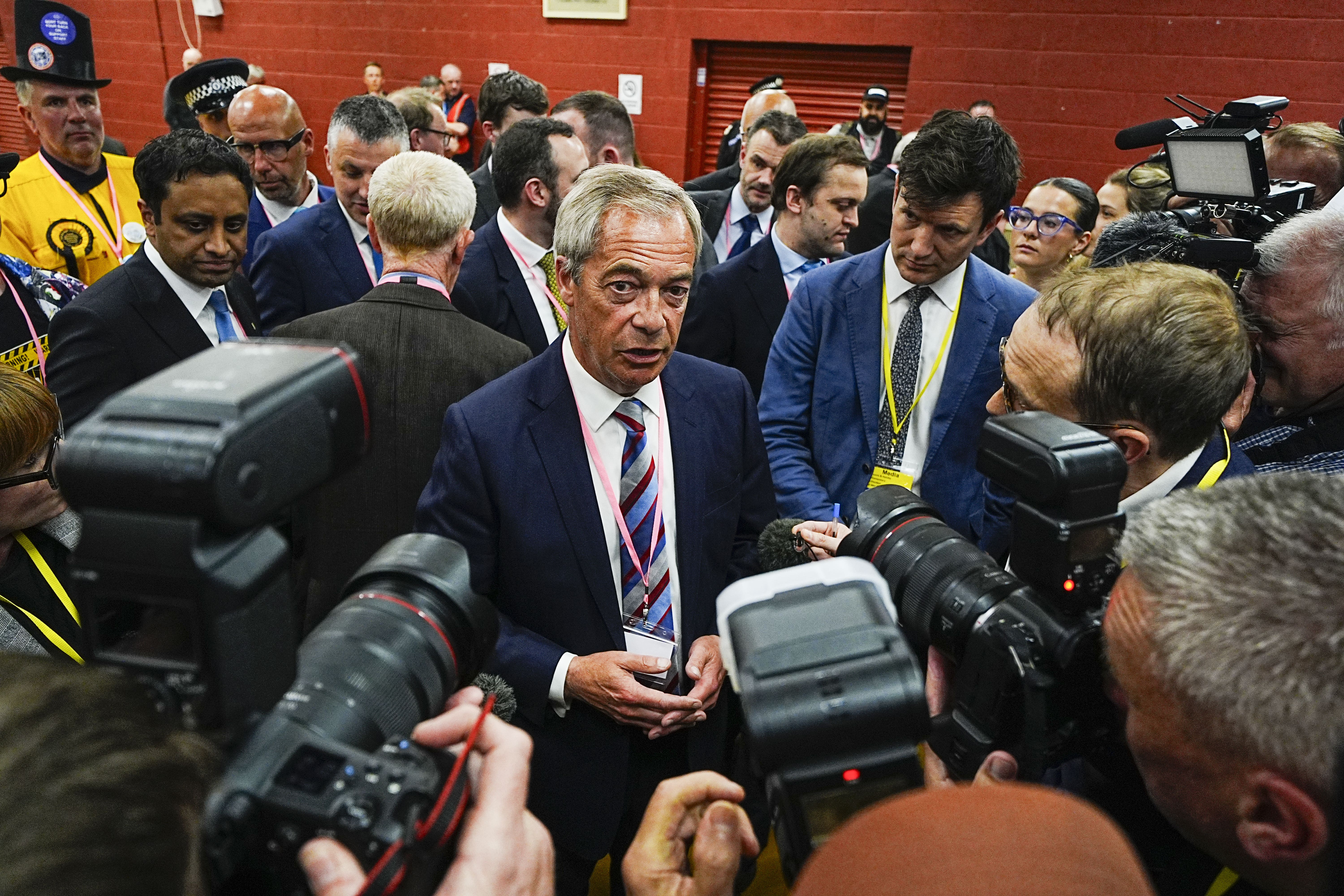 Nigel Farage talks to the media after Sarah Pochin won the Runcorn and Helsby by-election (Peter Byrne/PA)