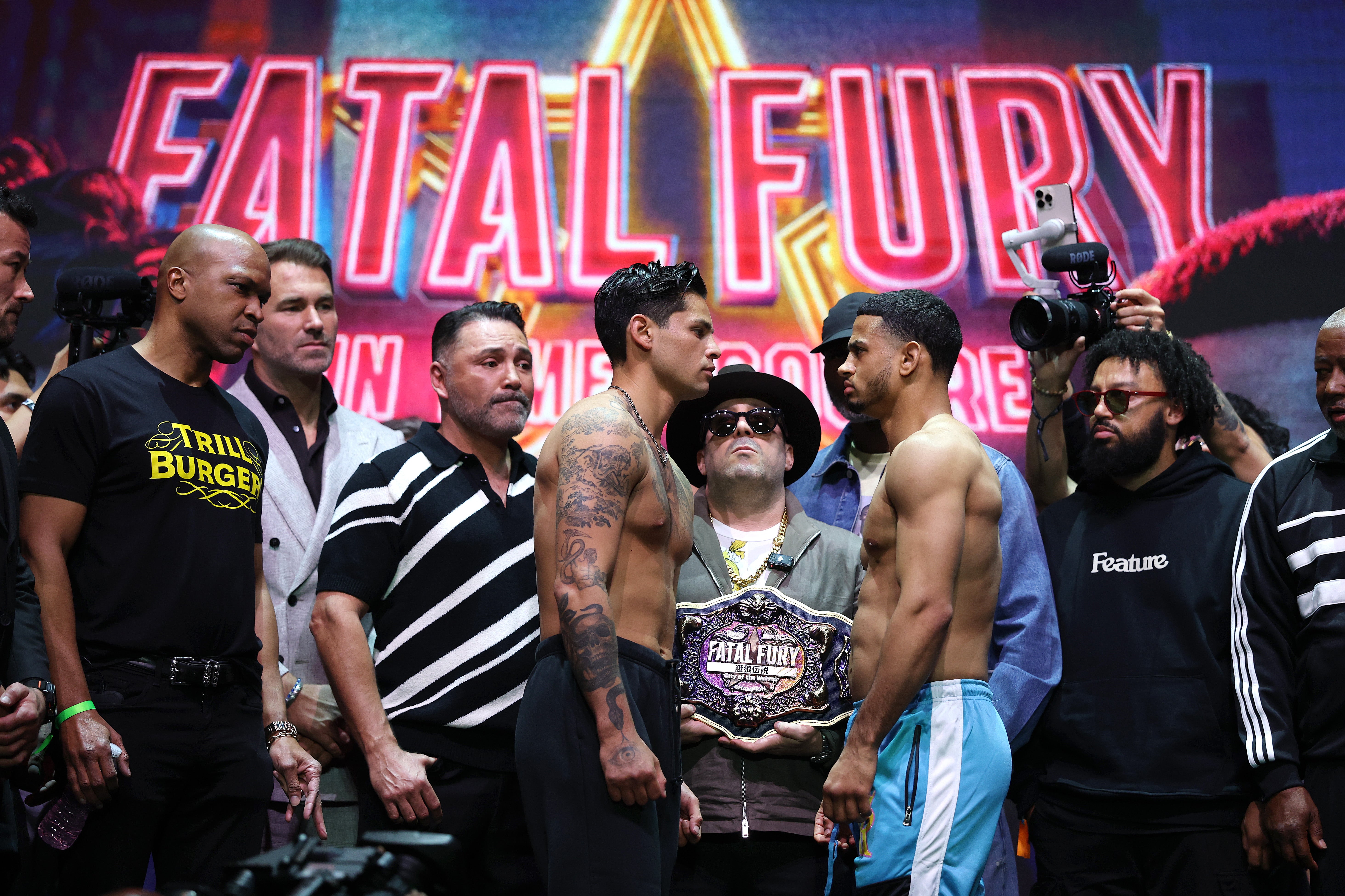 Ryan Garcia (left) and Rolly Romero during their weigh-in face-off