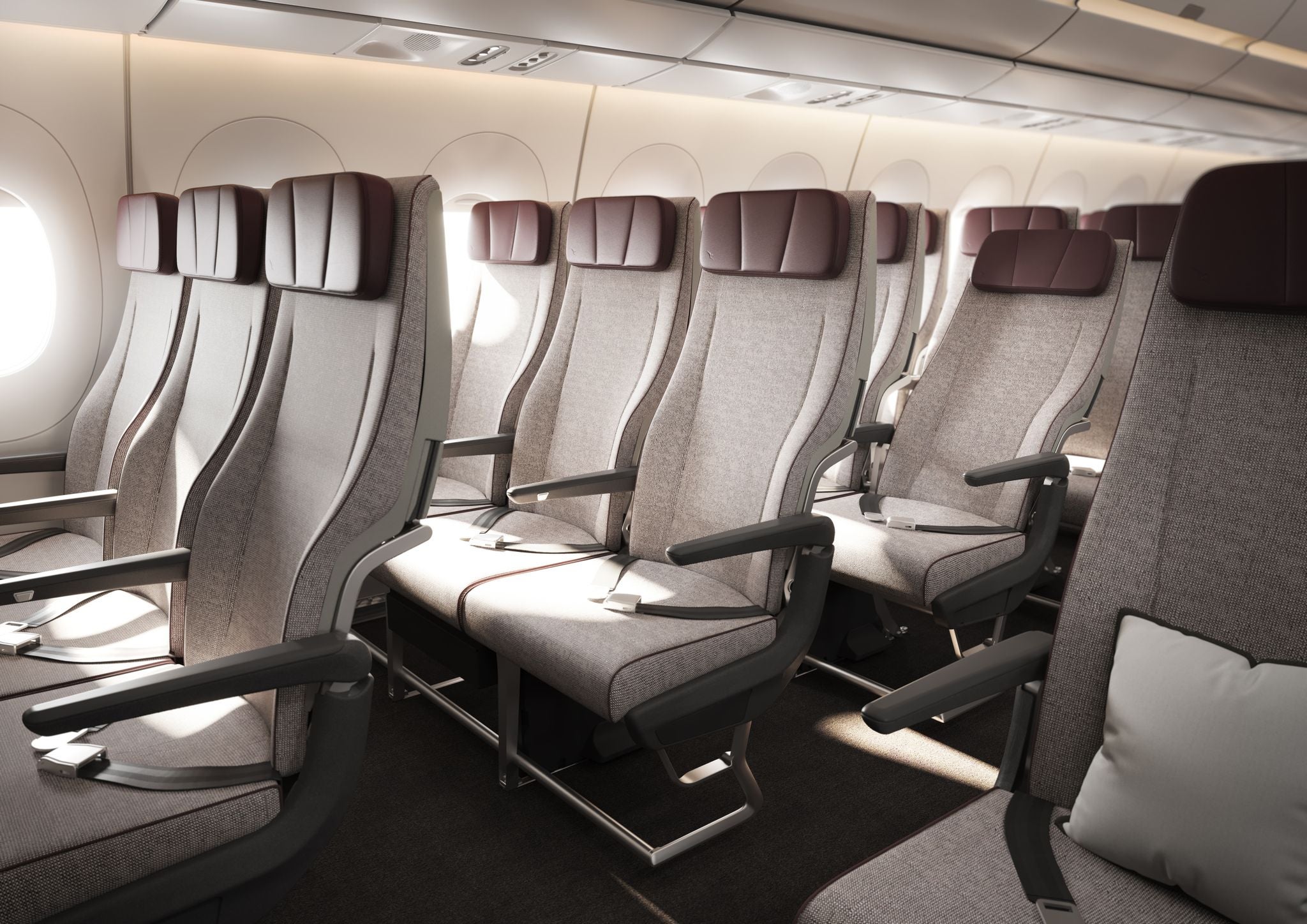 The economy seats shown in this rendering are arranged in a 3-3-3 pattern, have a 33-inch tone height and a six-way headrest