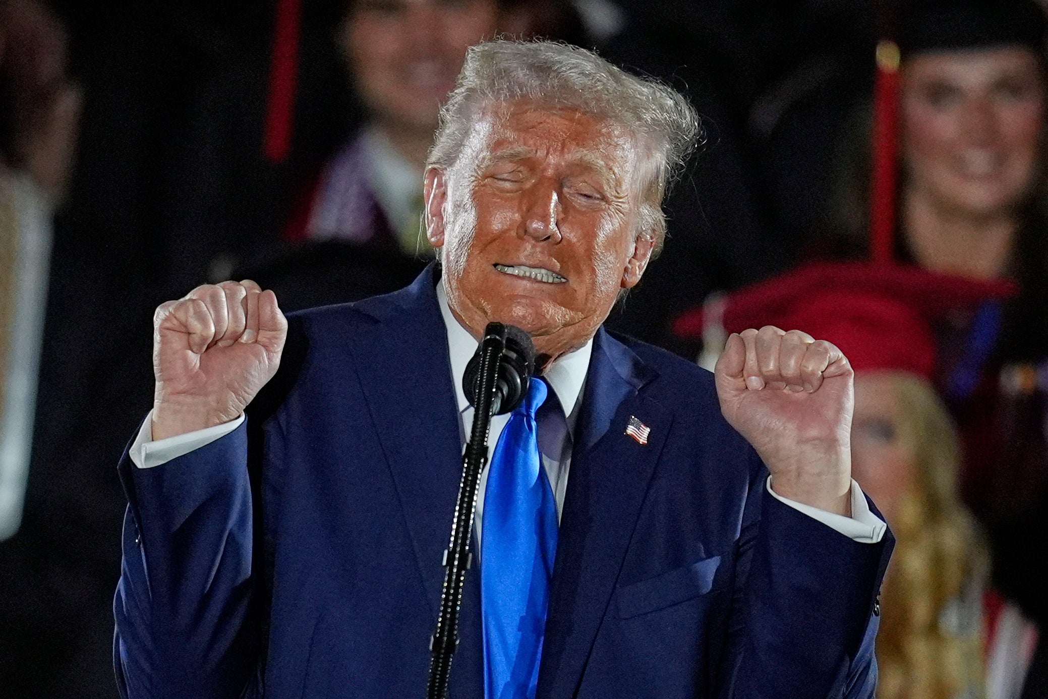 Trump used part of his speech to bash transgender athletes and did a weight-lifting impression.