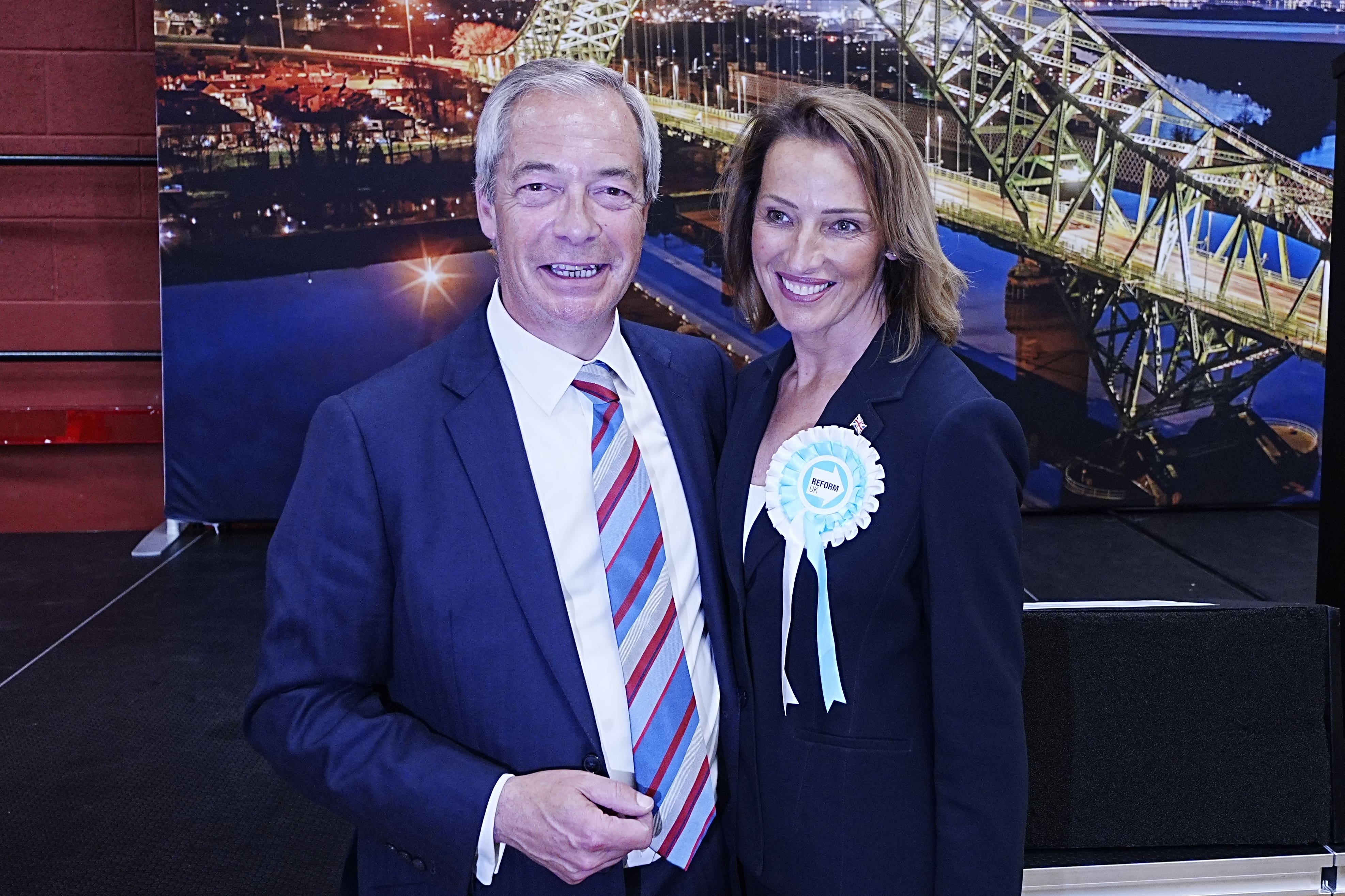 Reform UK’s Sarah Pochin and party leader Nigel Farage talk to the media after the party won the seat in the Runcorn and Helsby by-election (Peter Byrne/PA)