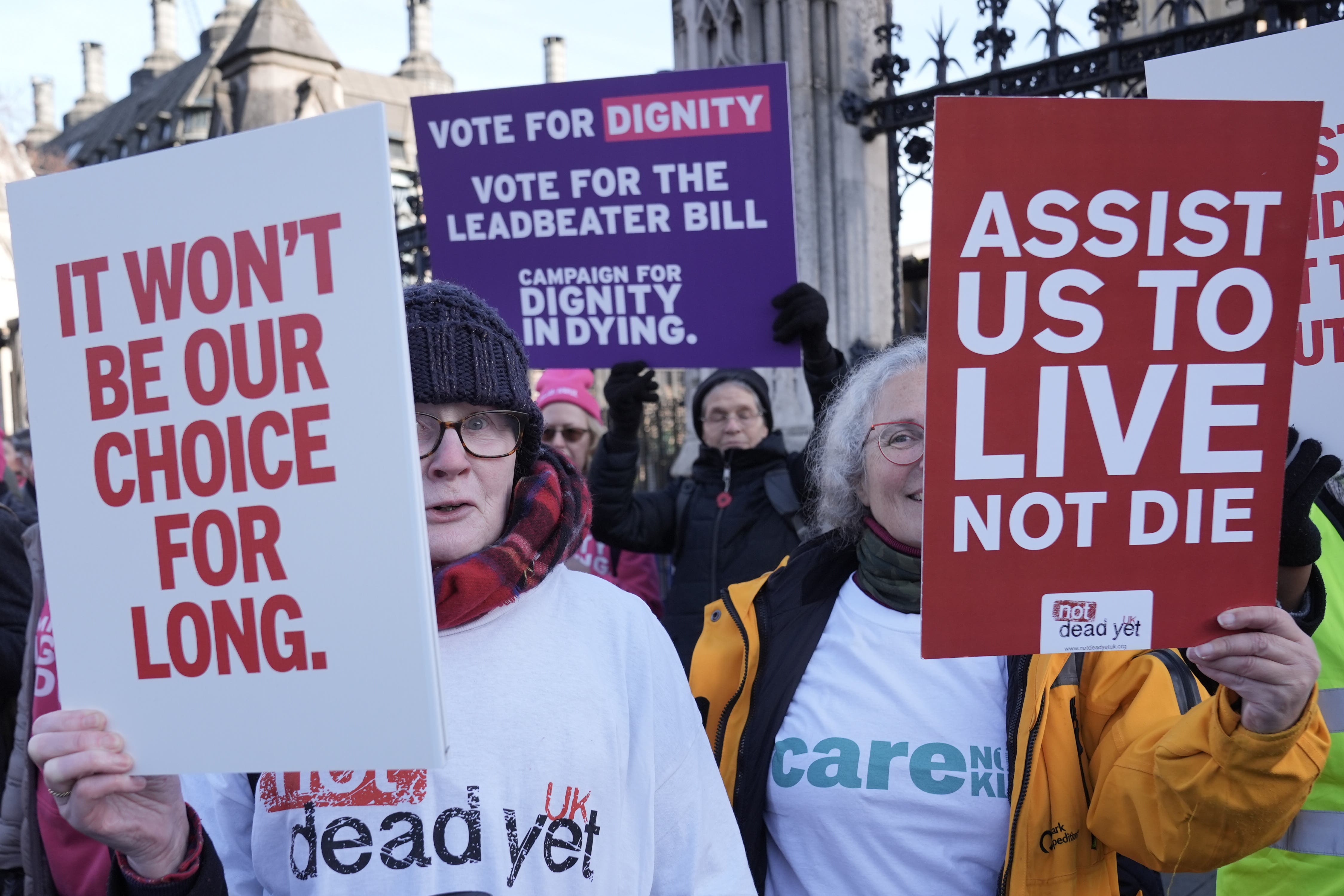 Campaigners for and against assisted dying outside Parliament (Stefan Rousseau/PA)
