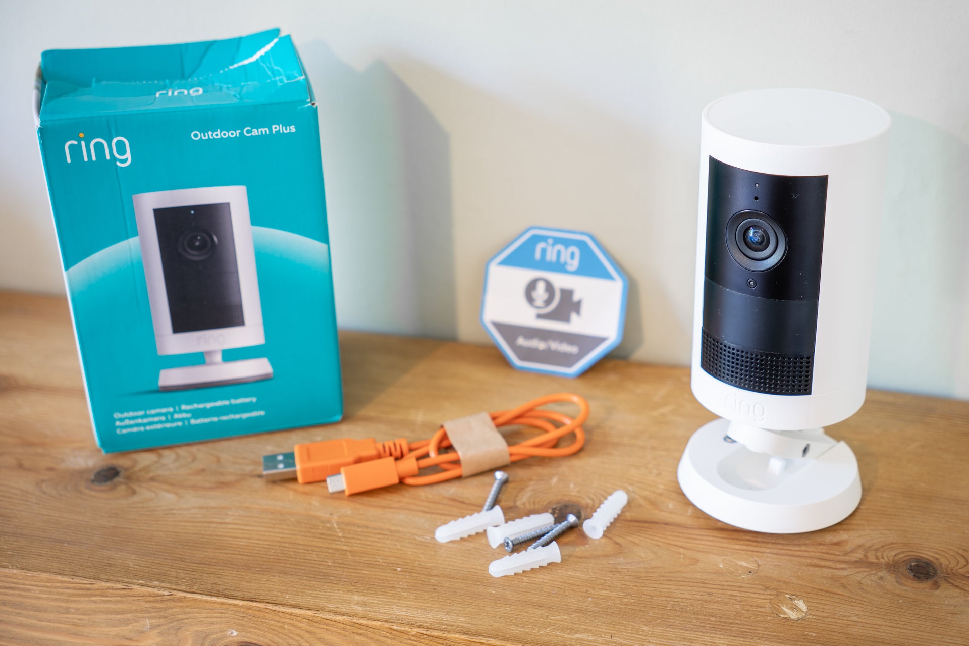The camera comes with a charge cable, plus screws and wall plugs for installation