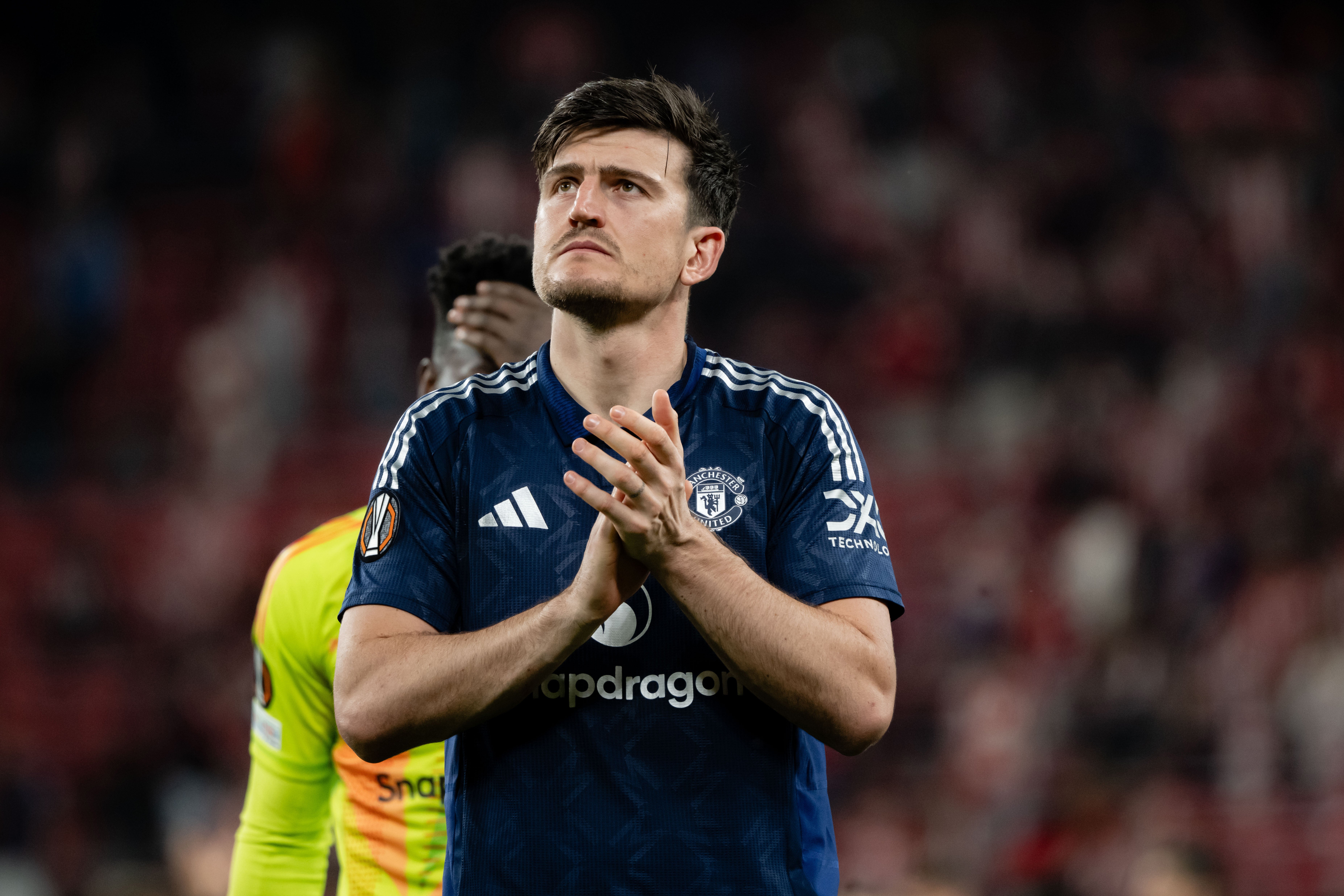 Harry Maguire of Manchester United applauds the fans in Bilbao