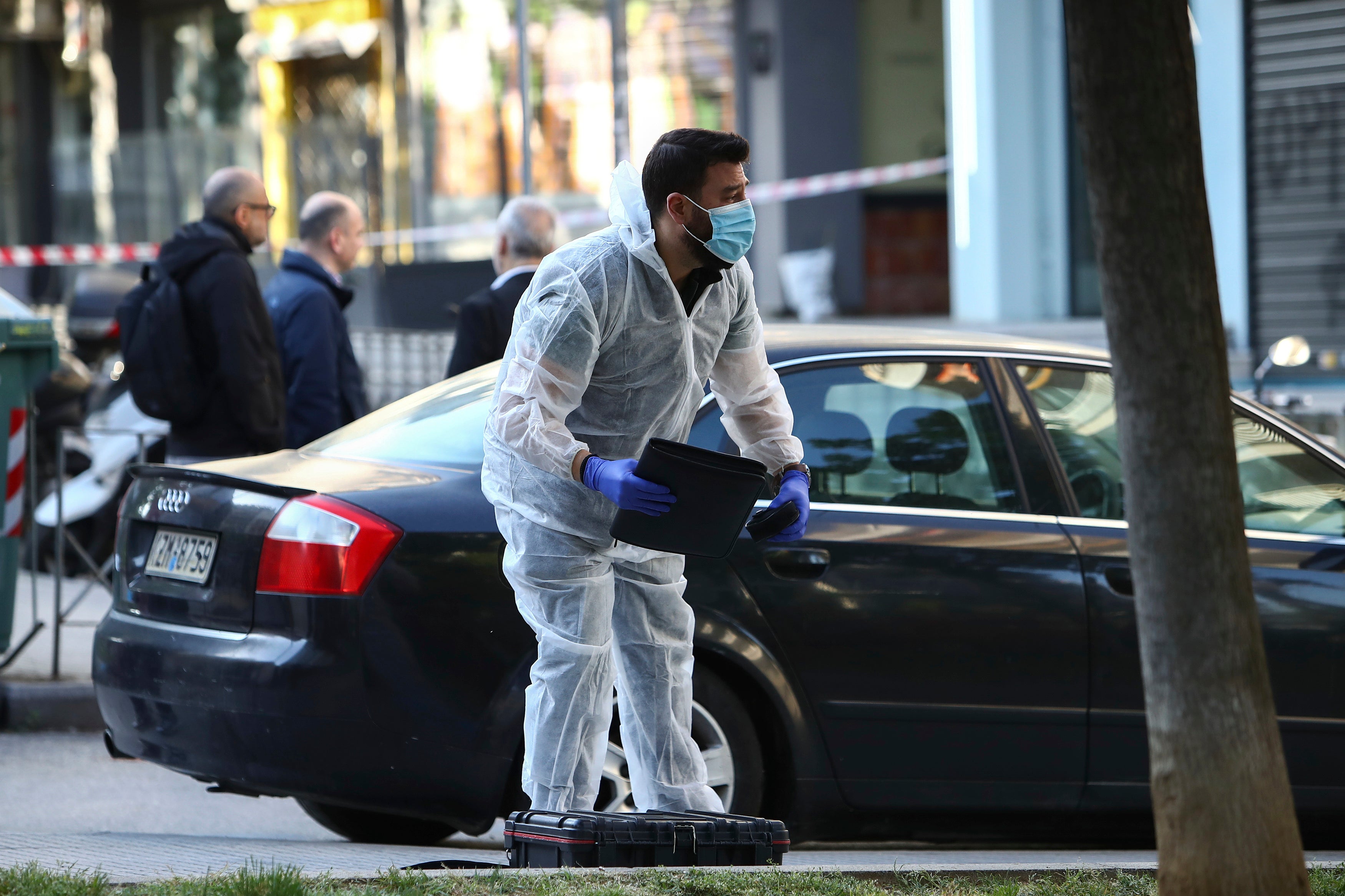 A Greek forensic expert searches for evidence