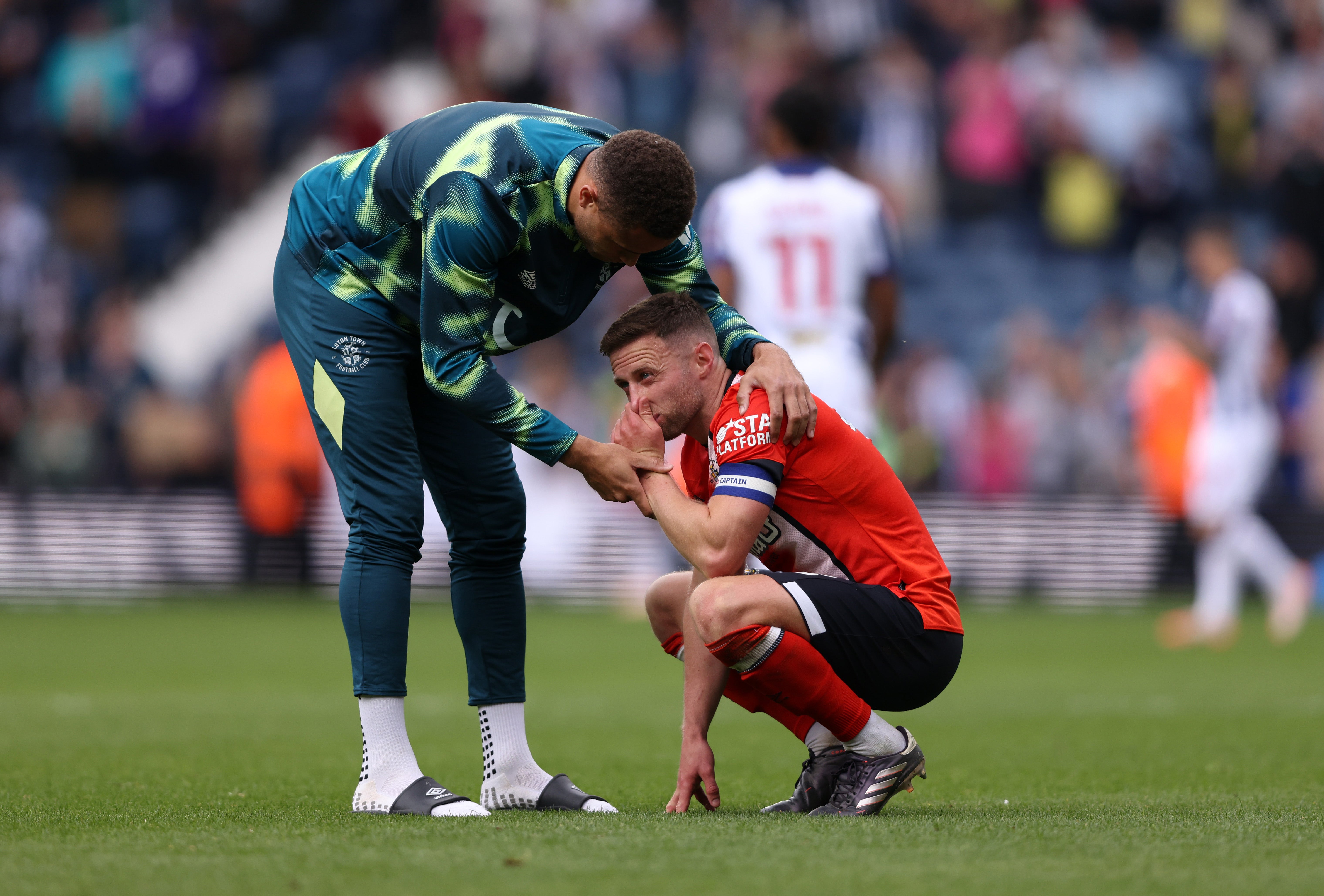 Carlton Morris consoles teammate Jordan Clark