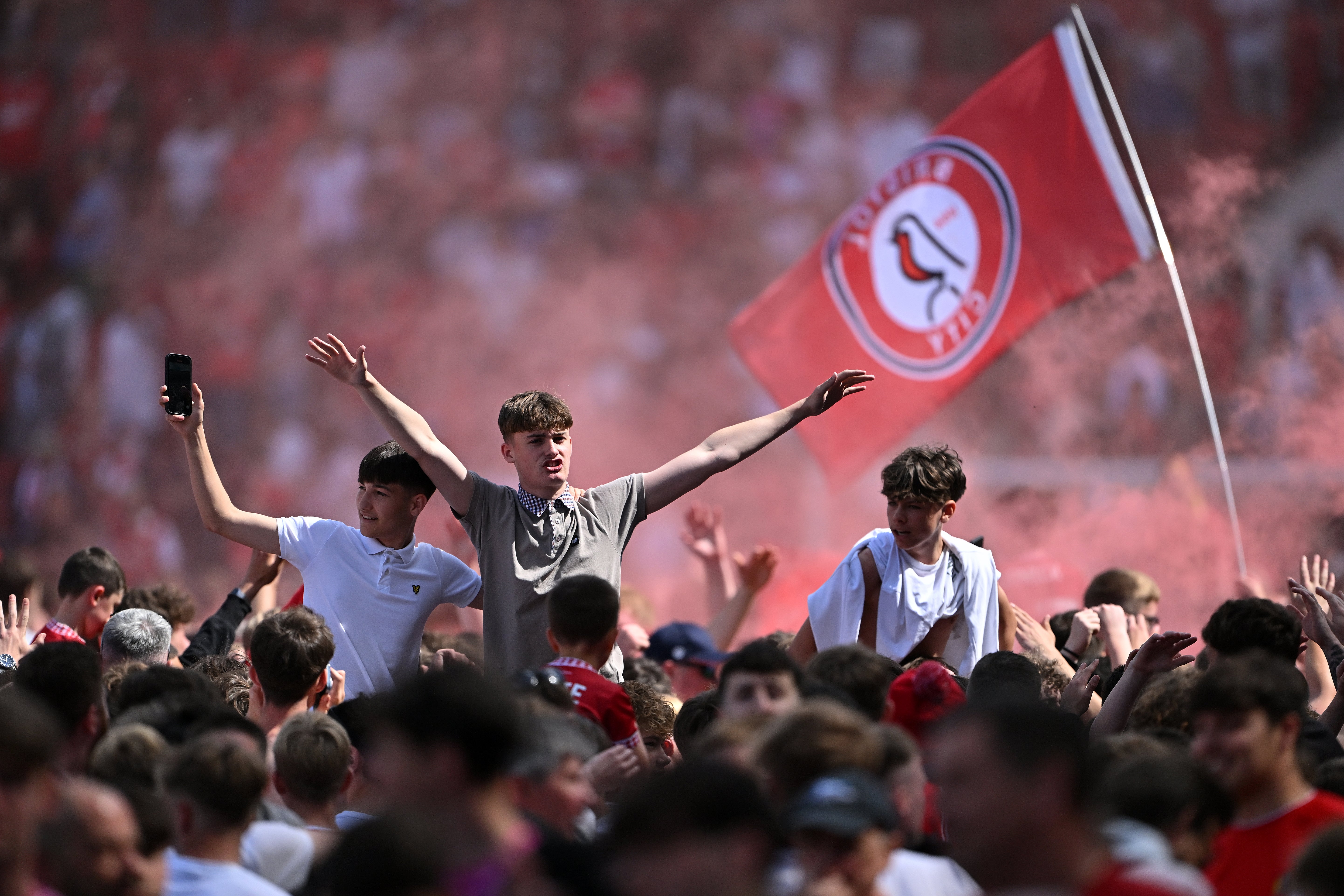 Bristol City fans celebrate with a pitch invasion