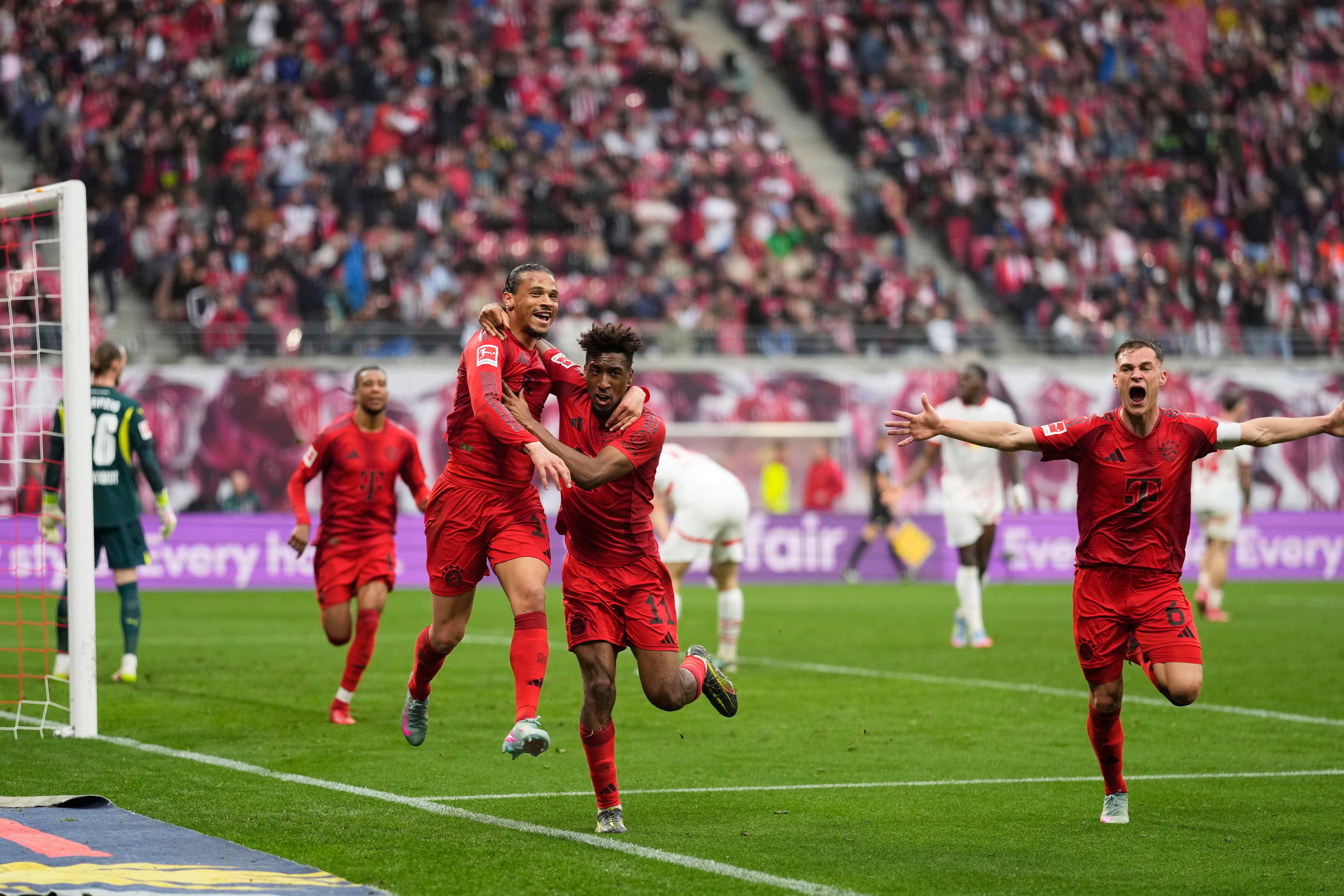 Bayern’s Leroy Sane, left, celebrates with Kingsley Coman after scoring his side’s third goal