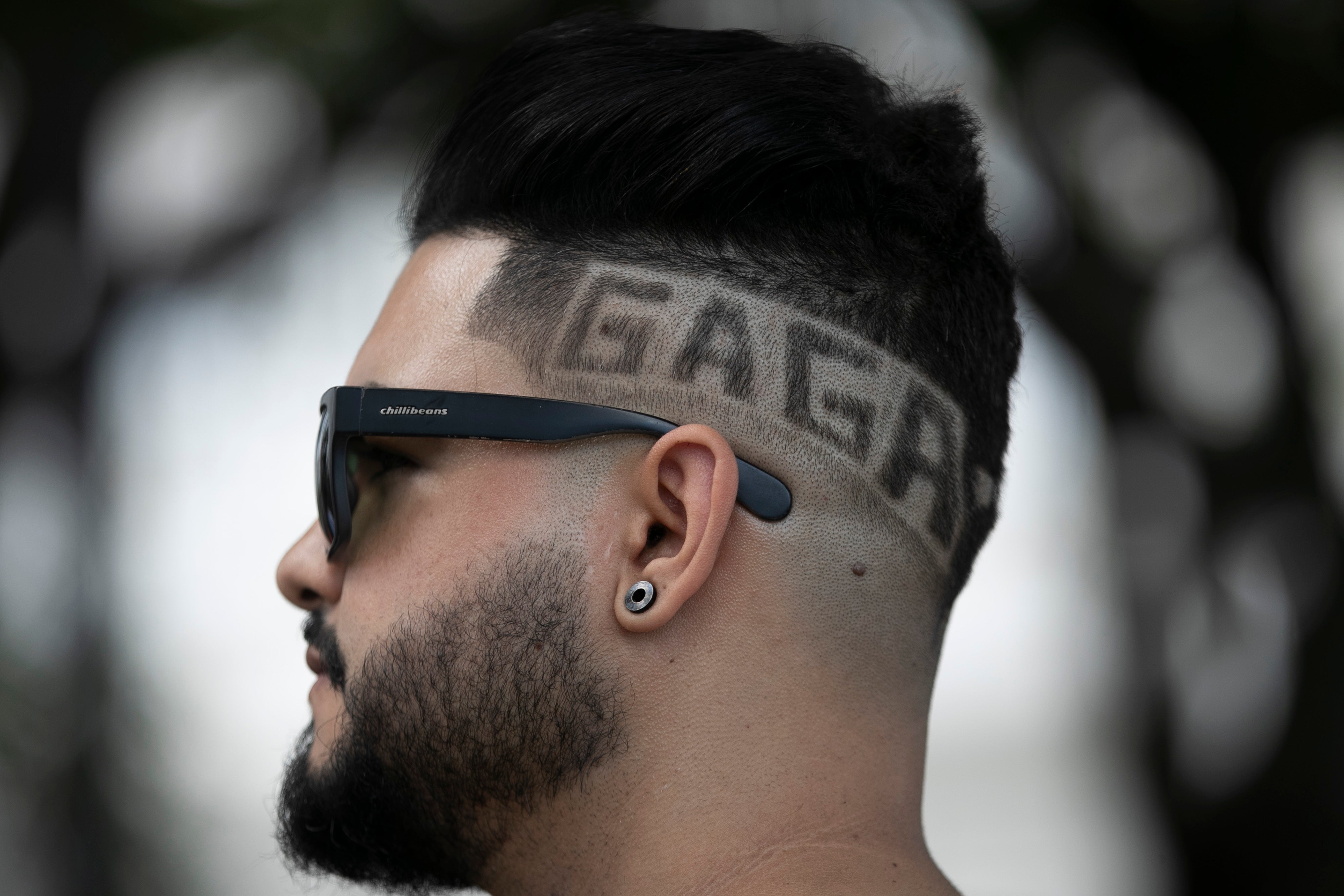 A Lady Gaga fan stands outside the Copacabana Palace hotel, where the pop diva is staying in Rio de Janeiro