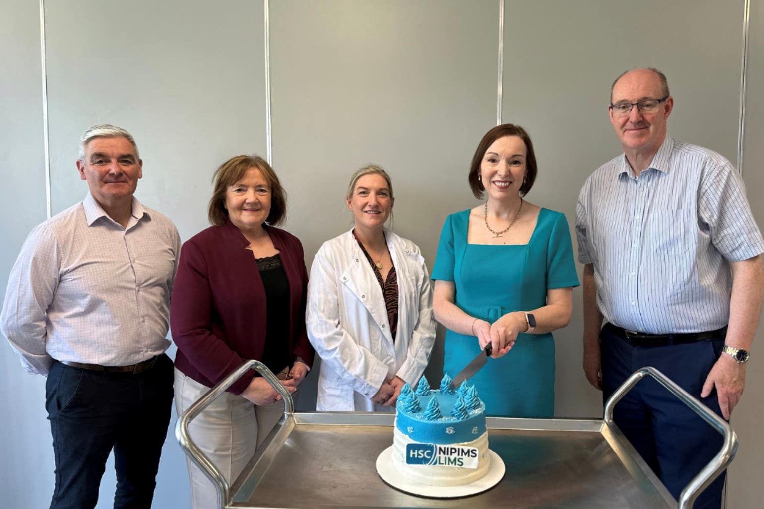 Northern Health Trust chief executive Jennifer Welsh (second right) joins WHSCT laboratory staff to celebrate the rollout of CoreLIMS (Niall O’Hagan/HSCNI/PA)