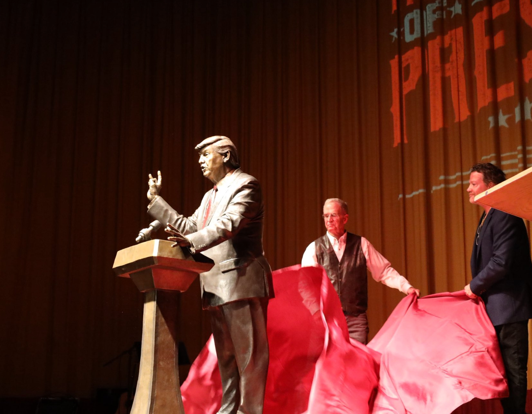 A statue of Donald Trump is unveiled in Rapid City, South Dakota. The auditorium was half-filled and a protest took place nearby