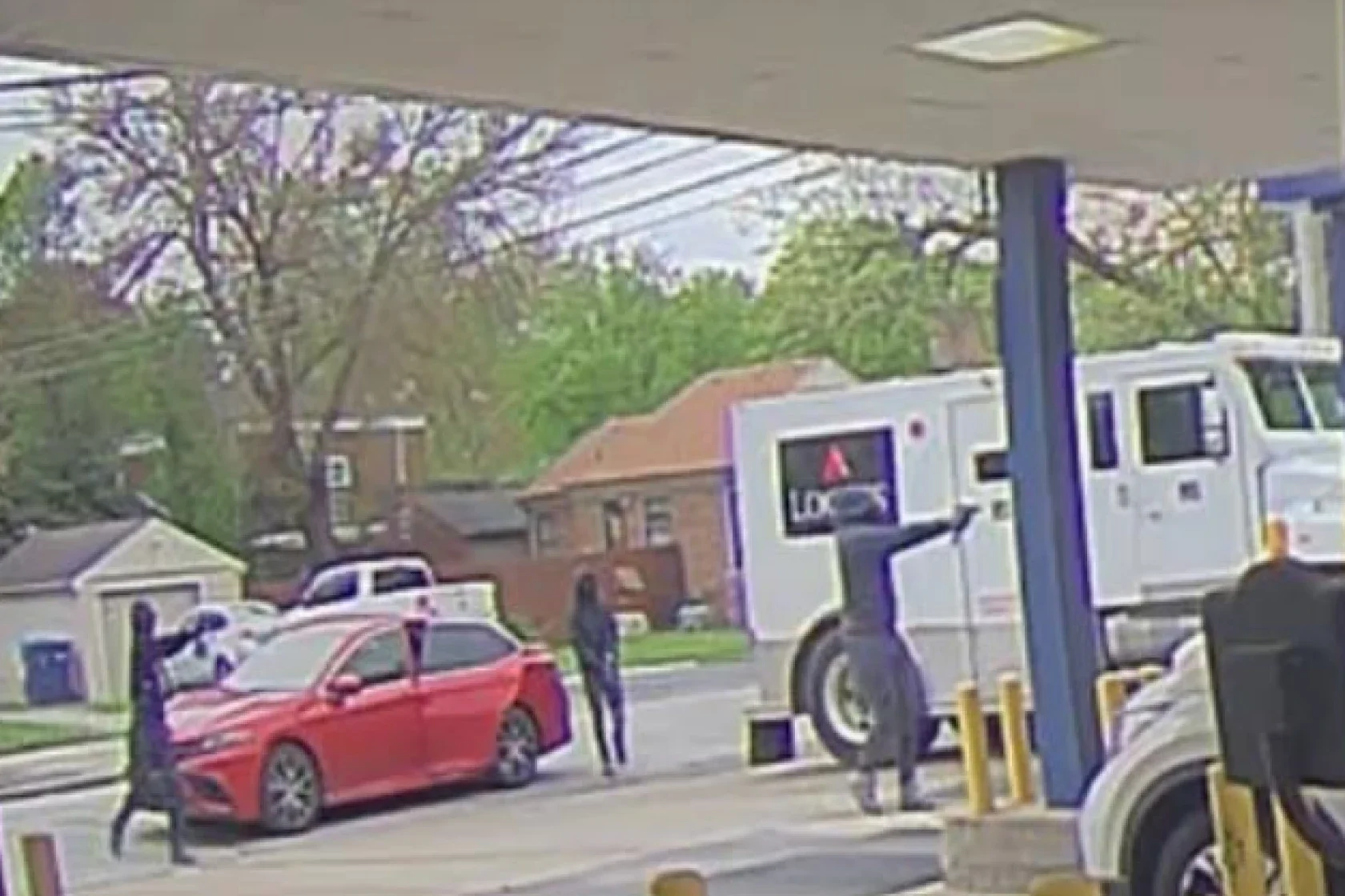 The FBI is searching for three men accused of holding up an armored truck at gunpoint outside of a bank