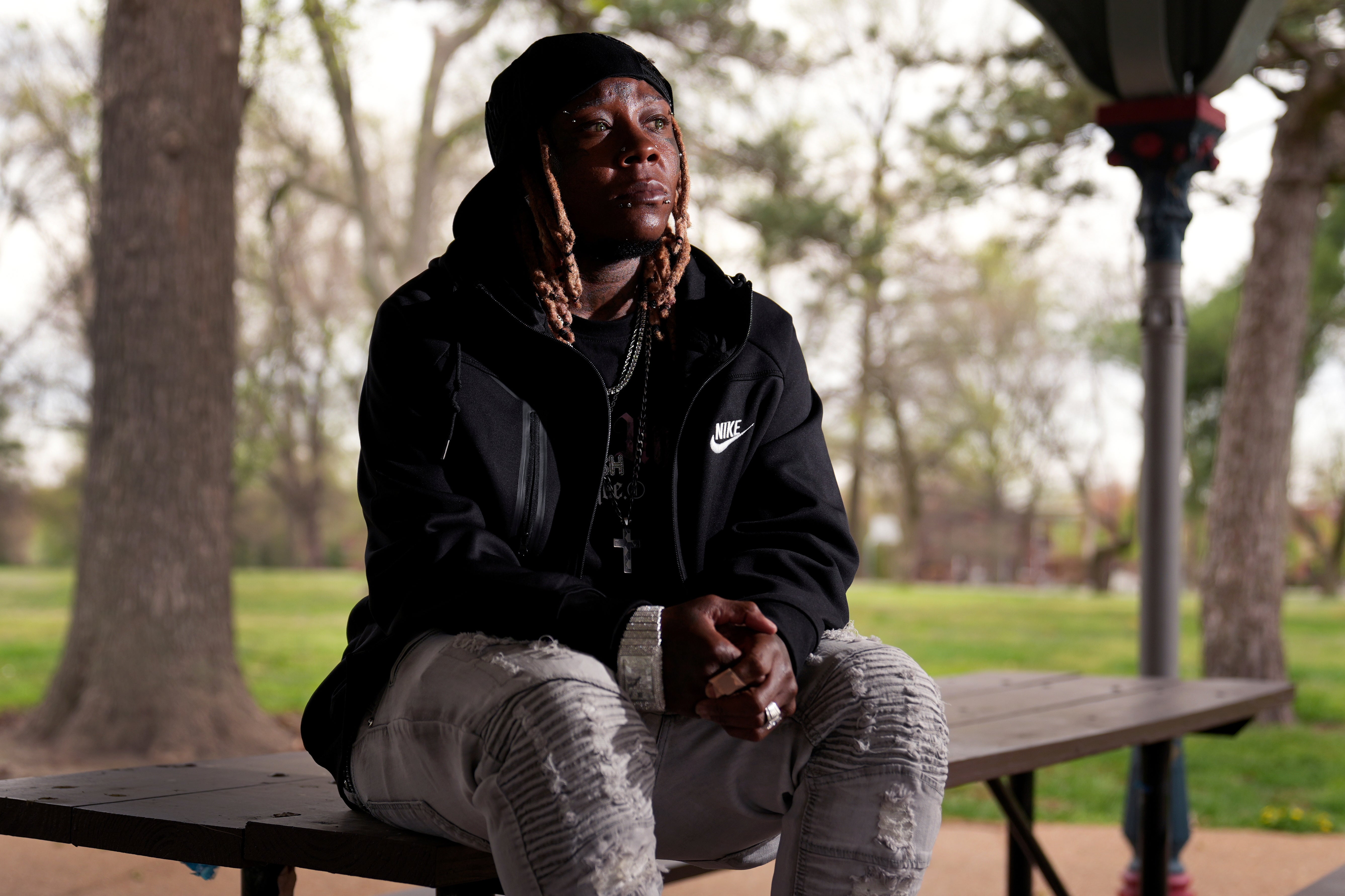 Tazz Webster, who ultimately wound up homeless after an apartment manager allegedly ridiculed and shoved him because he is transgender, poses for a photo, April 9, 2025, in St. Louis. (AP Photo/Jeff Roberson)