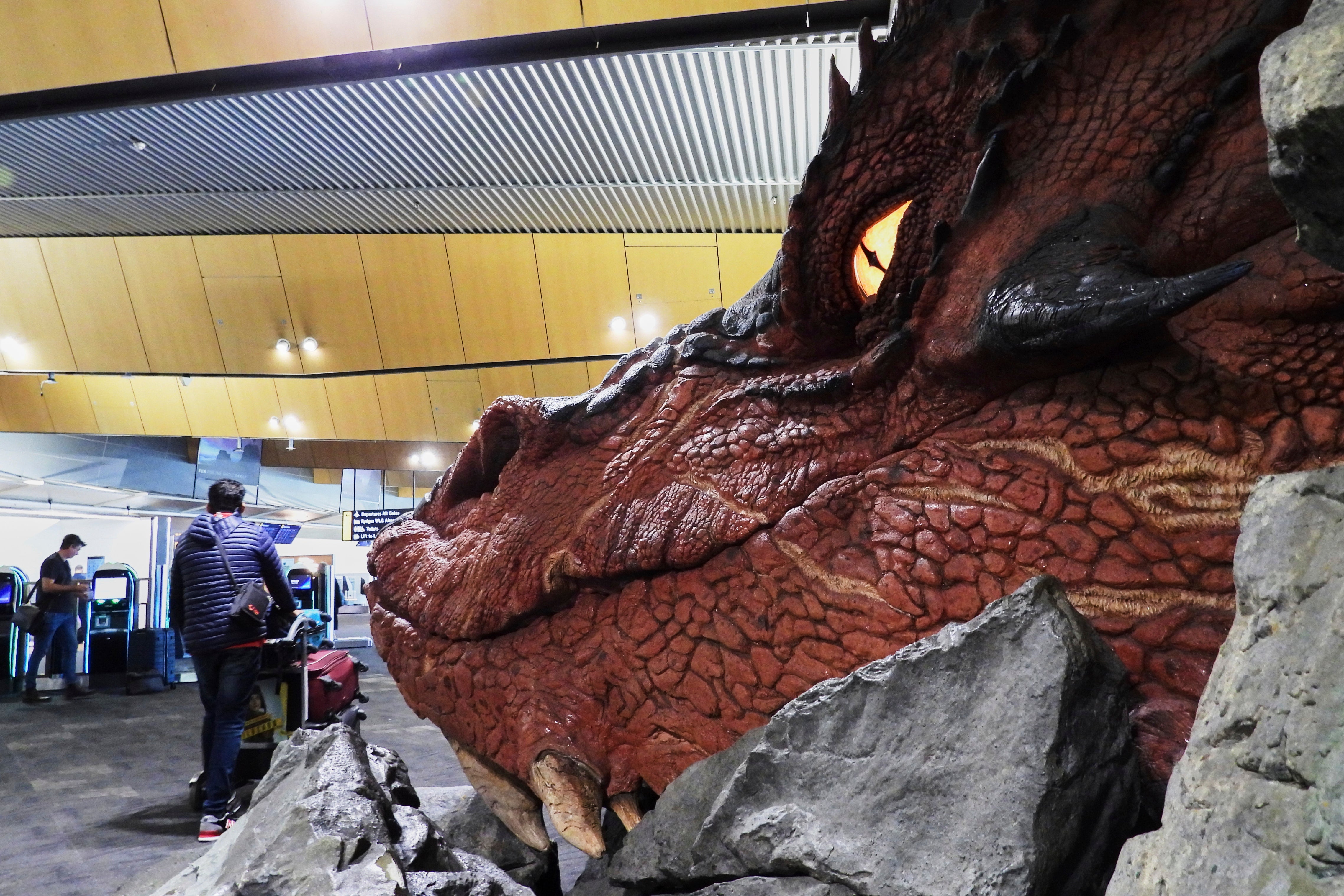 An enormous sculpture of The Hobbit’s gold-hoarding dragon, Smaug, will remain overlooking the check-in counters