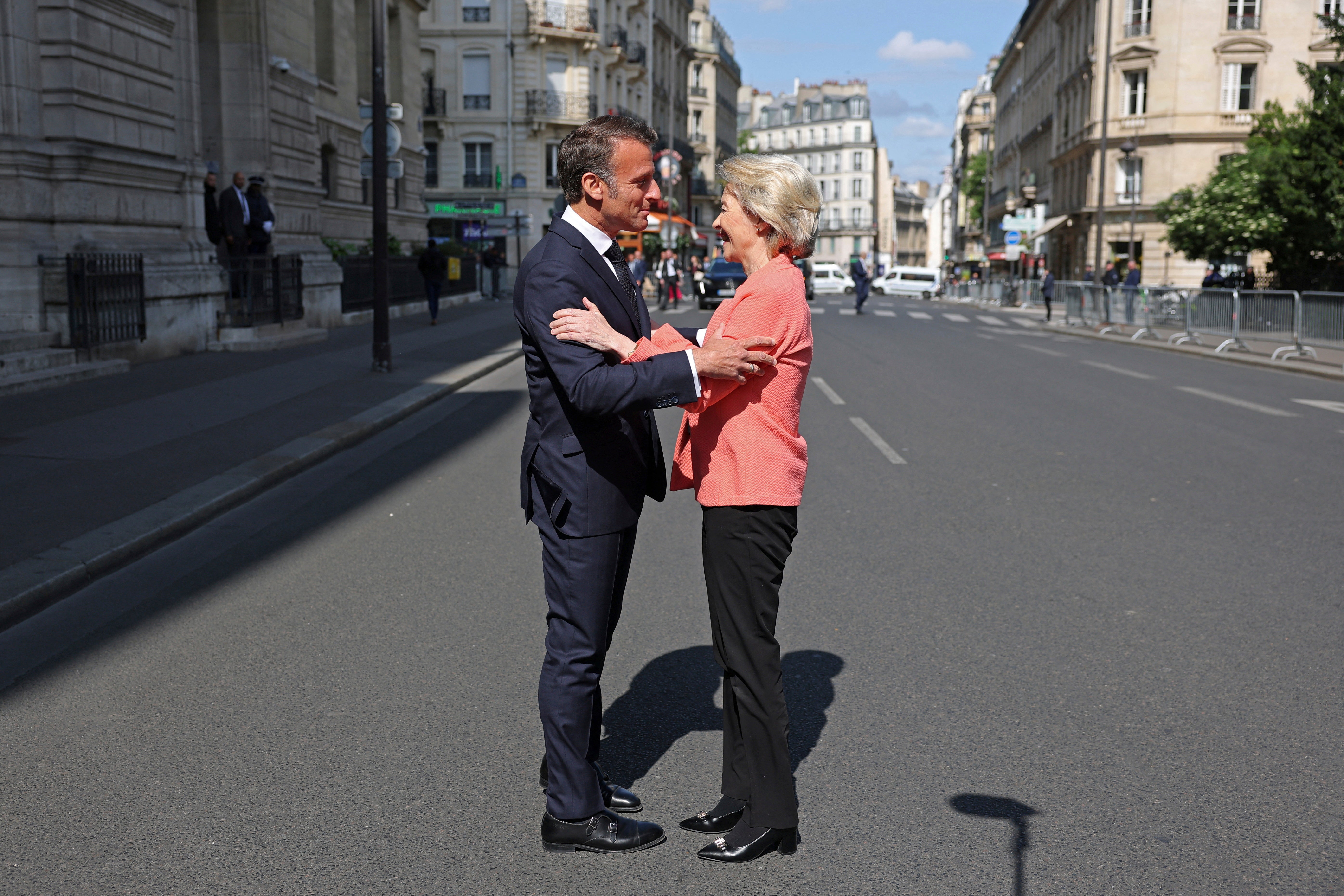 French President Emmanuel Macron welcomes European Commission President Ursula Von der Leyen as she arrives at the "Choose Europe for Science" event, to encourage researchers and scientists from all over the world to practice in Europe, at the Sorbonne University in Paris, Monday, May 5, 2025.(Gonzalo Fuentes/Pool via AP)