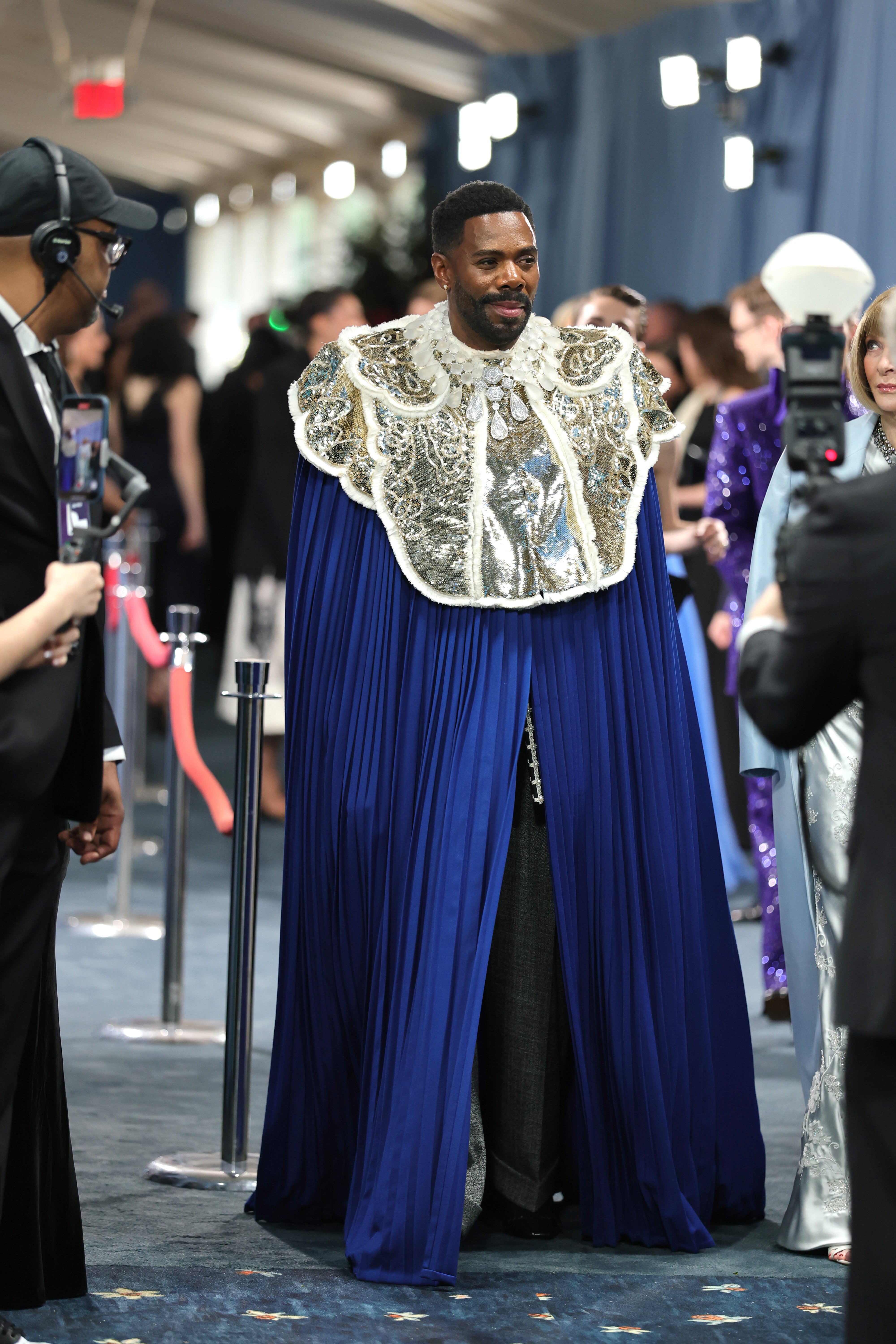 Met Gala co-chair Colman Domingo wore a custom blue robe by Valentino. The look included white fabric chest armor, which he completed with a diamond statement necklace