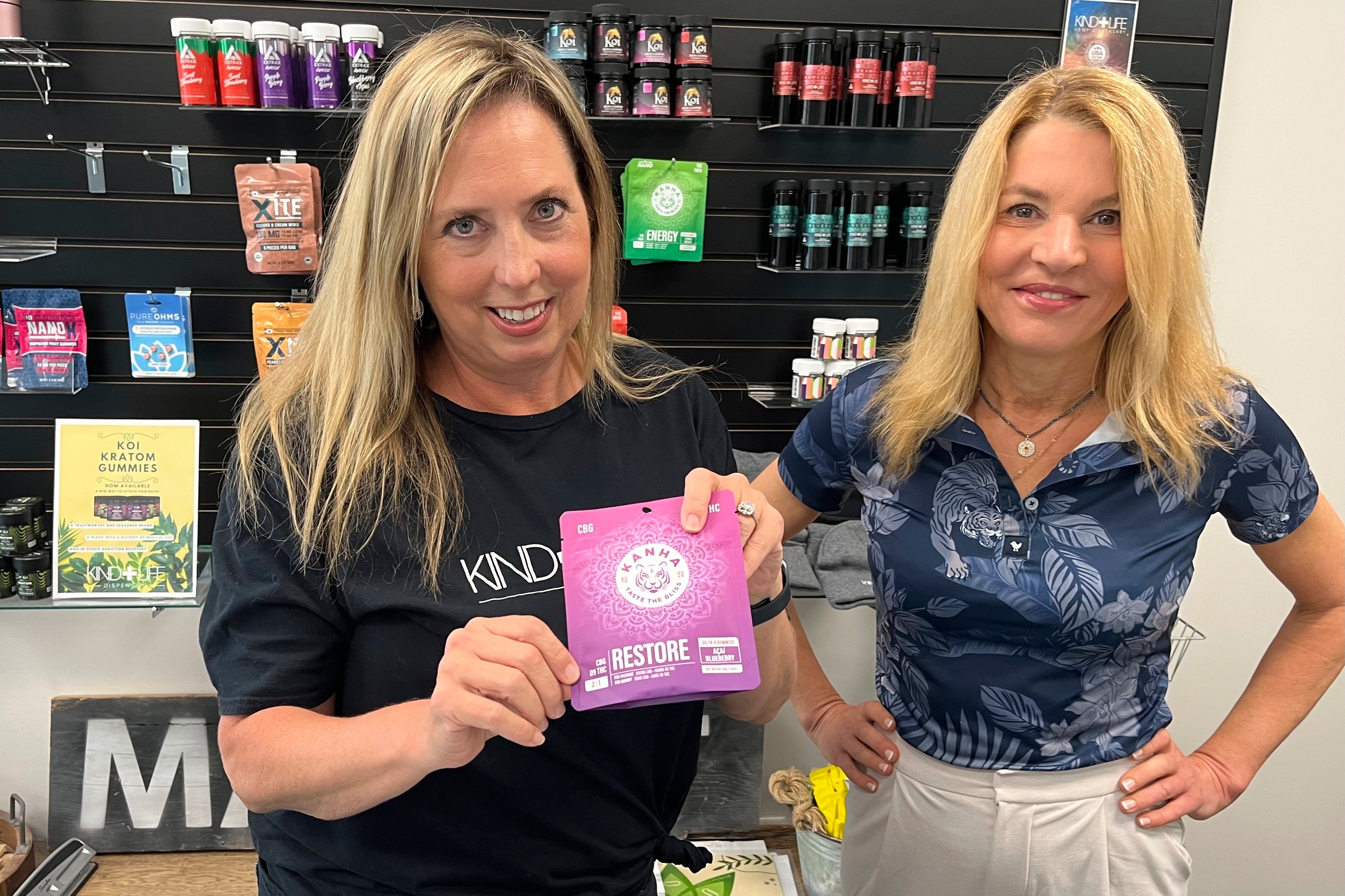 Andrea Watkins, left, and Dr. Andrea Holmes, right, co-owners of Kind Life Dispensary that sells an array of products containing hemp-based THC in their shop in Lincoln, Nebraska.
