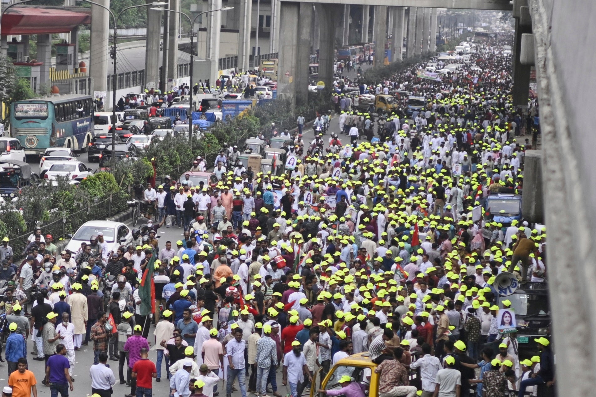 Supporters of Bangladesh's former prime minister Khaleda Zia march on a road as they welcome her arrival in Dhaka on 6 May 2025