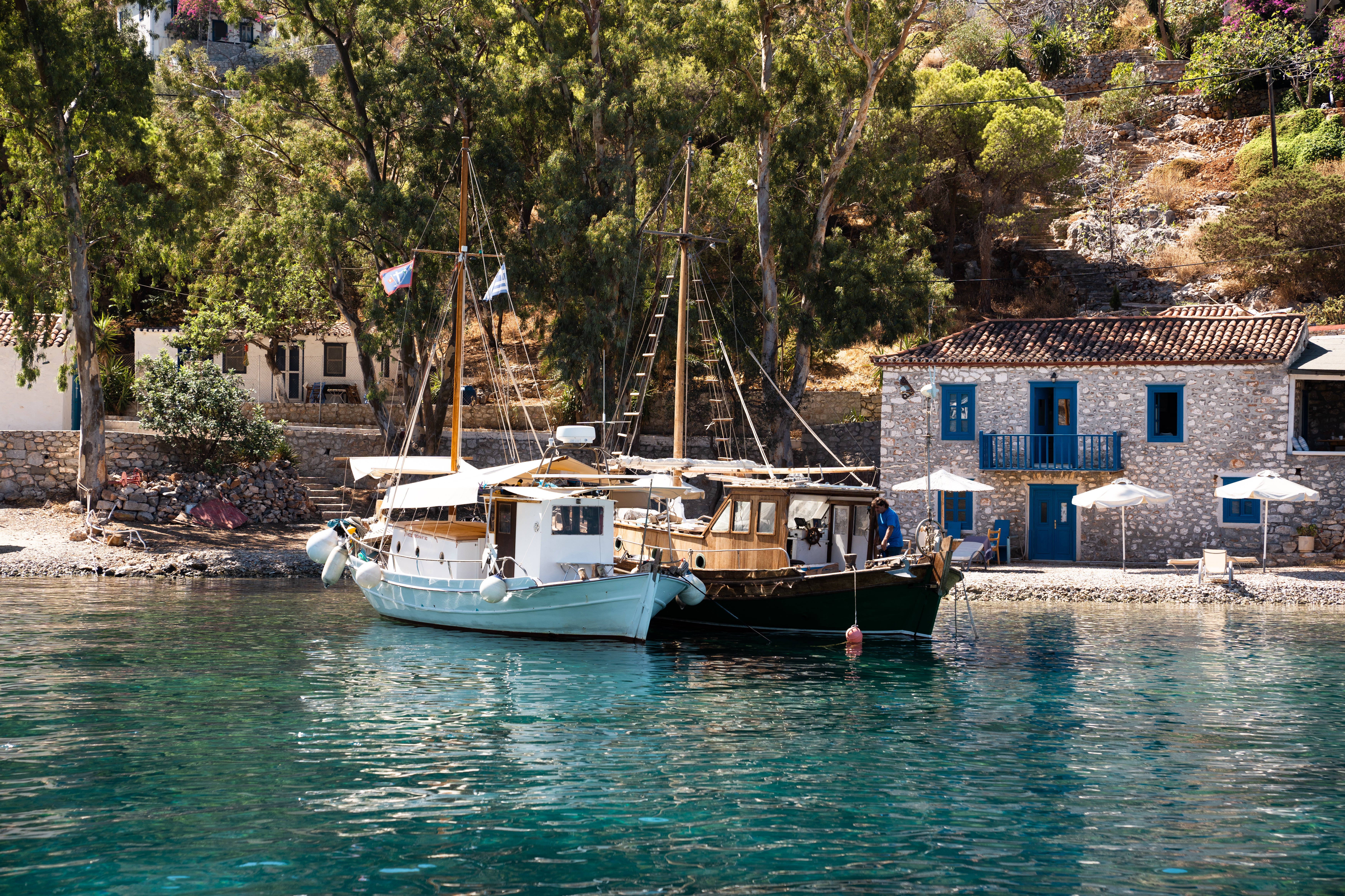Explore Hydra’s pretty coves, coastal towns and beaches by boat