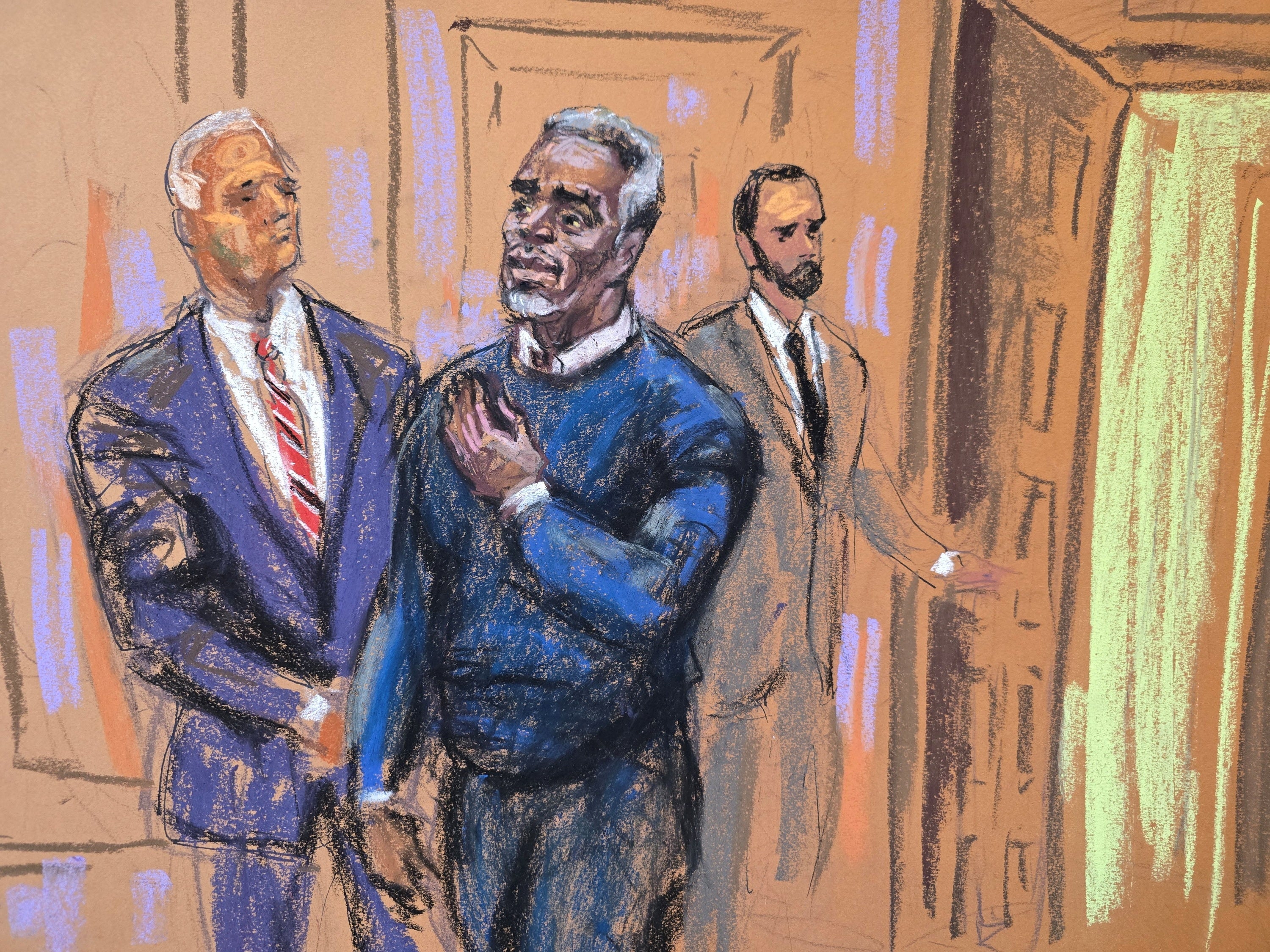 Sean 'Diddy' Combs puts his hand on his heart as he enters the courtroom for jury selection at the start of his sex trafficking trial in New York