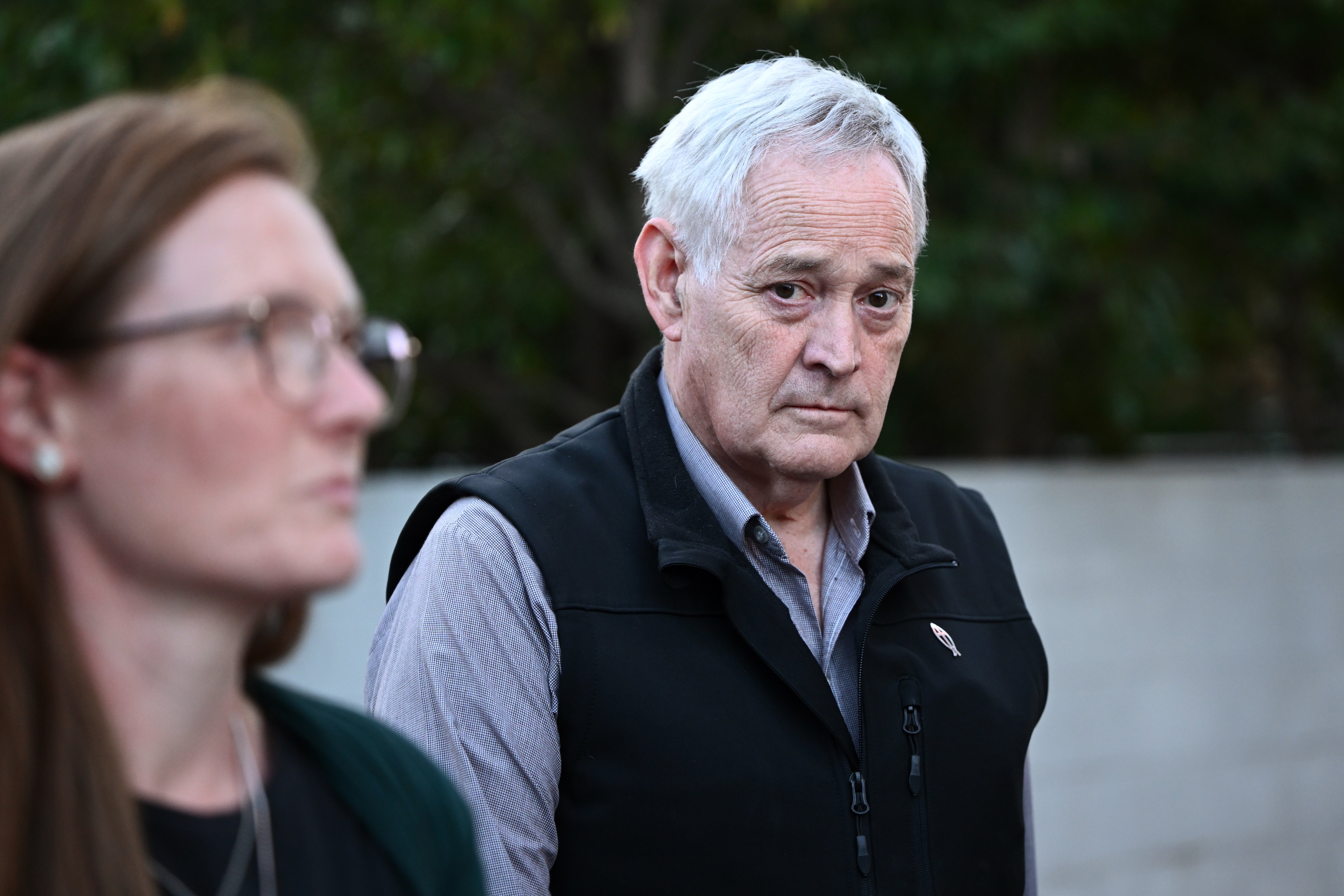 Ian Wilkinson (R), the only surviving guest of a lunch at Erin Patterson's house, leaves after testifying at a Supreme Court sitting at the Latrobe Valley Courts in Morwell, Victoria