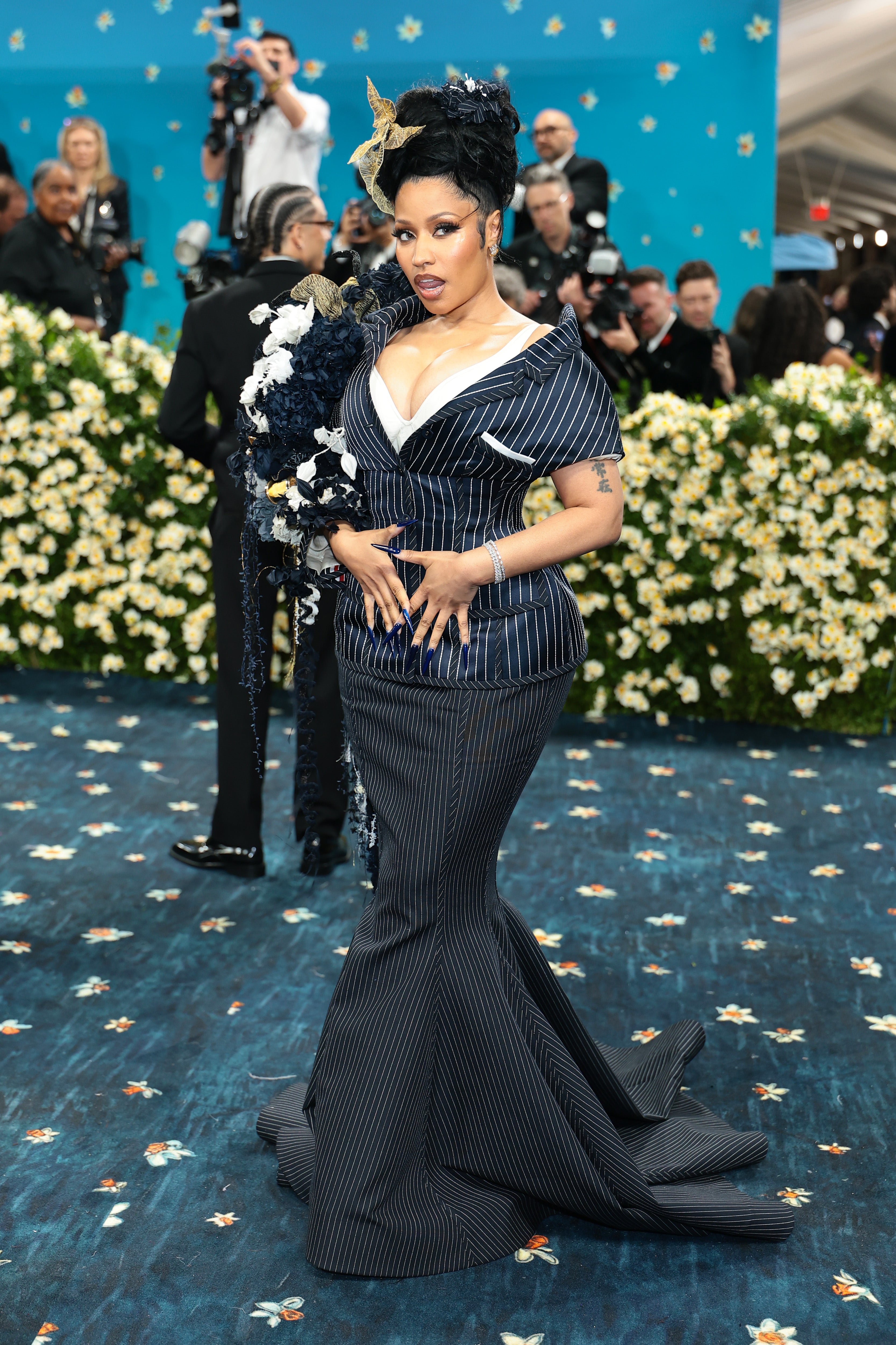 Nicki Minaj showed up to the Met Gala in pinstripes and a suit-inspired gown