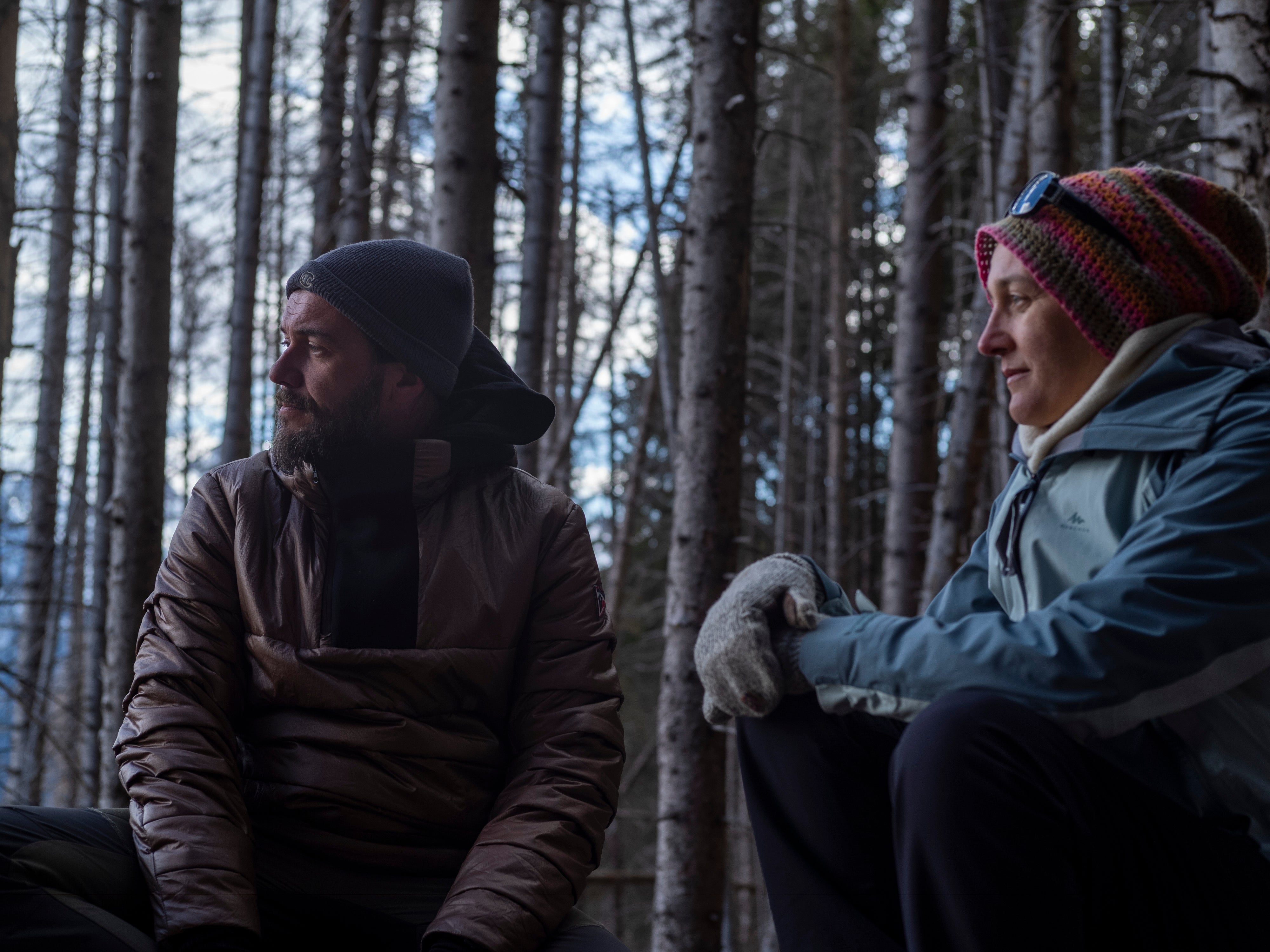 Study authors Alessandro Chiolerio and Monica Gagliano sit among the trees. Chiolerio says they now see the forest as an ‘orchestra’ instead of as a group of individual plants