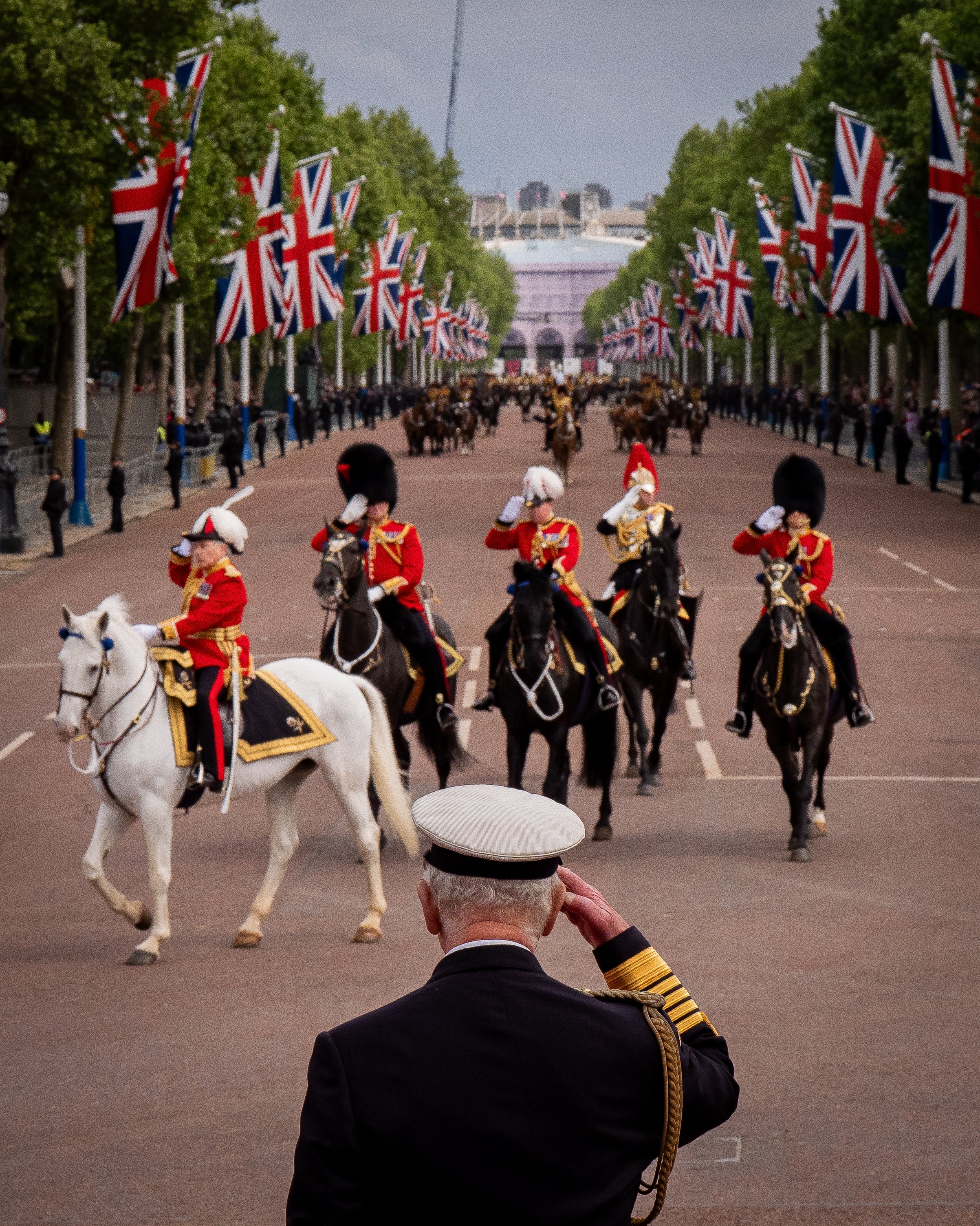 King Charles III takes greetings from a military delivery signifying 80. Anniversary ve day