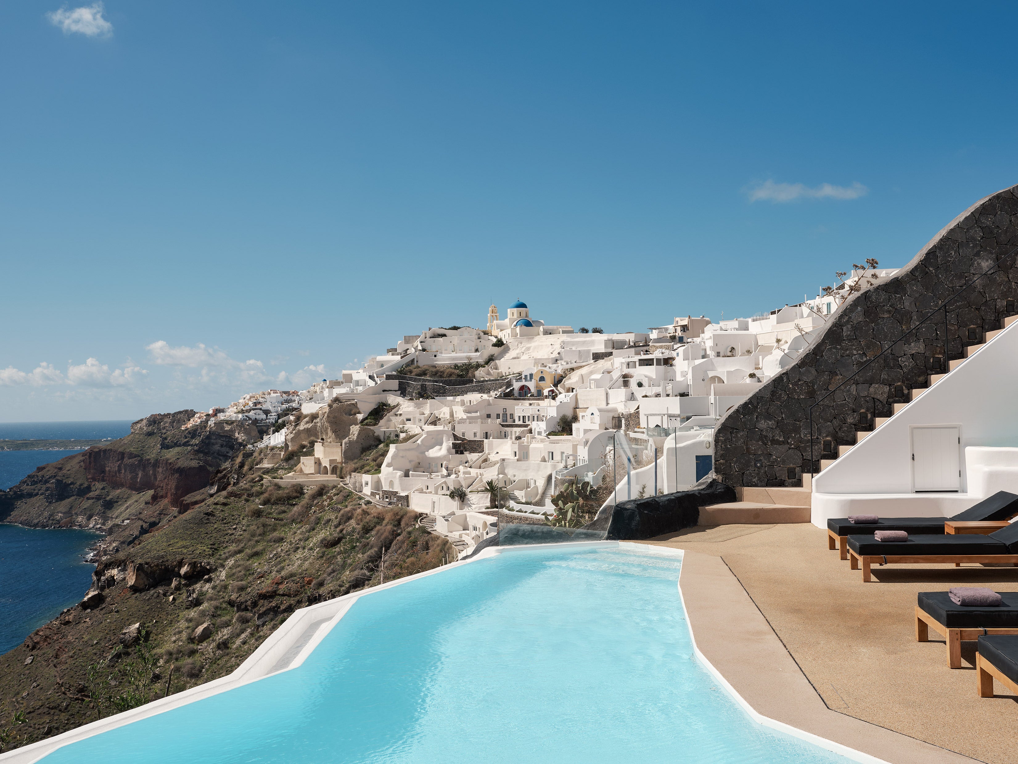 <p>Santorini is known for its cliffside whitewashed hotels, with suites cascading down the side of the caldera</p>
