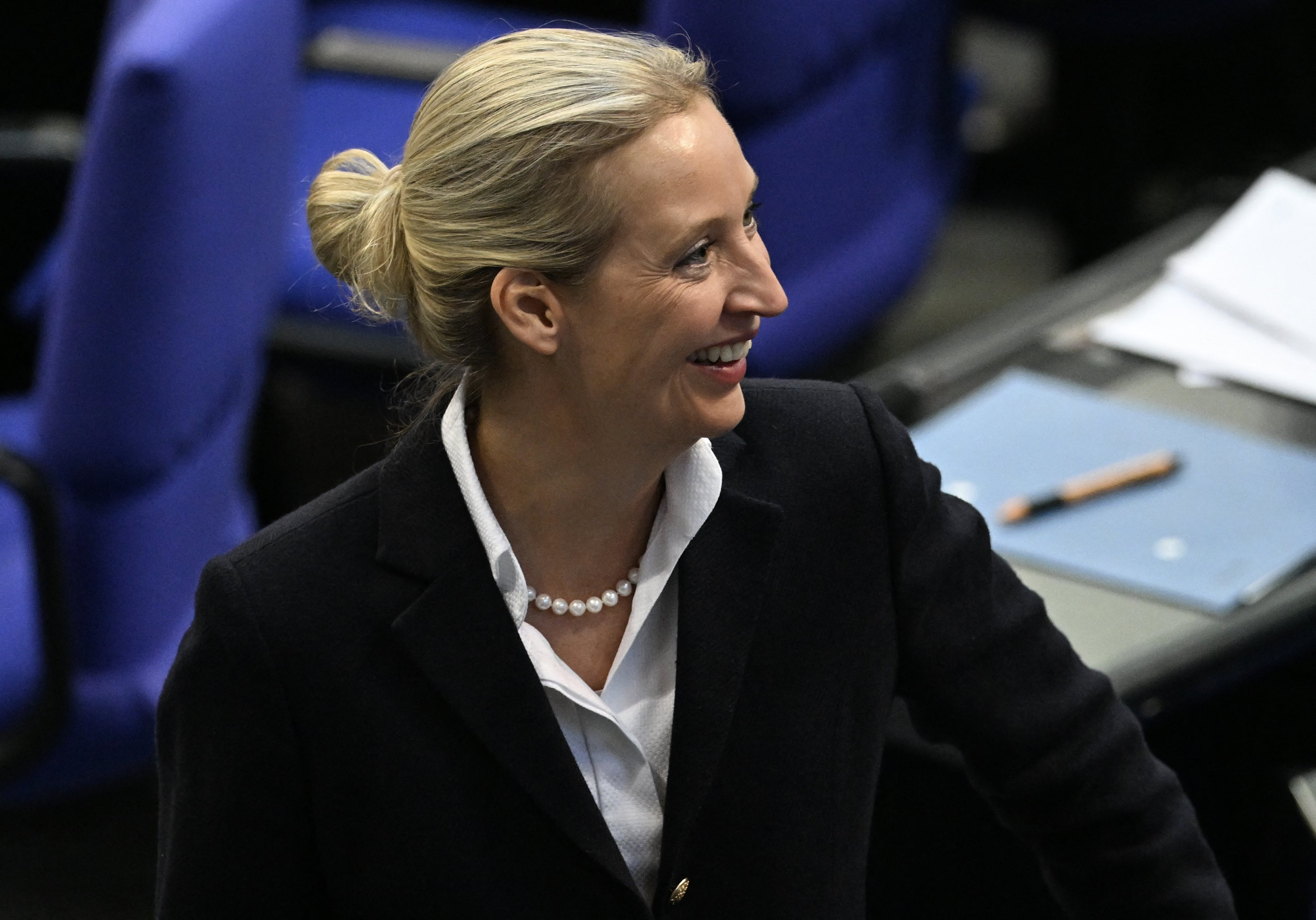 The co-leader of the far-right Alternative for Germany (AfD) party Alice Weidel smiles in reaction to the result of the first round of voting at the Bundestag