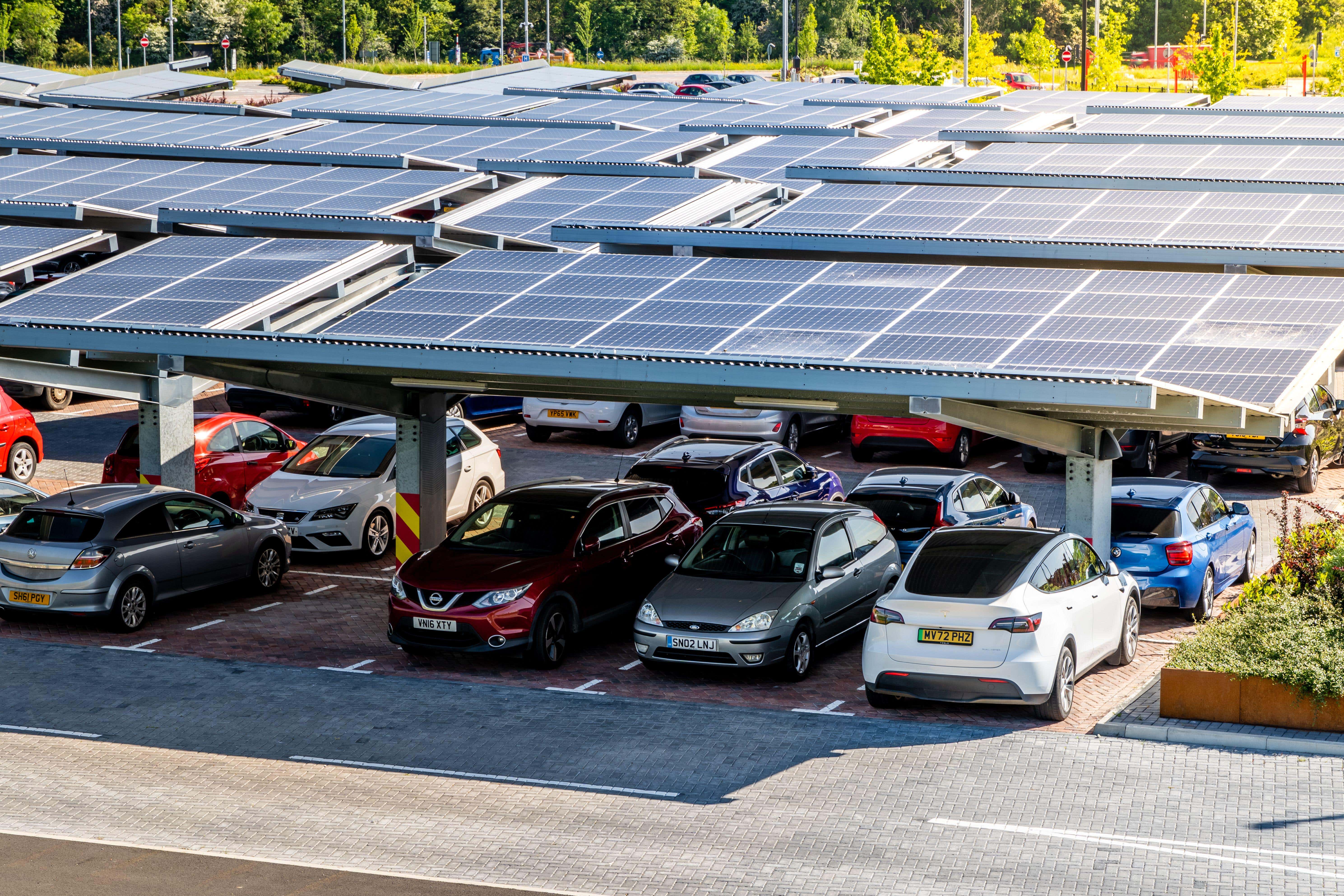 A parking lot with solar panels for electric car charging in Leeds, UK