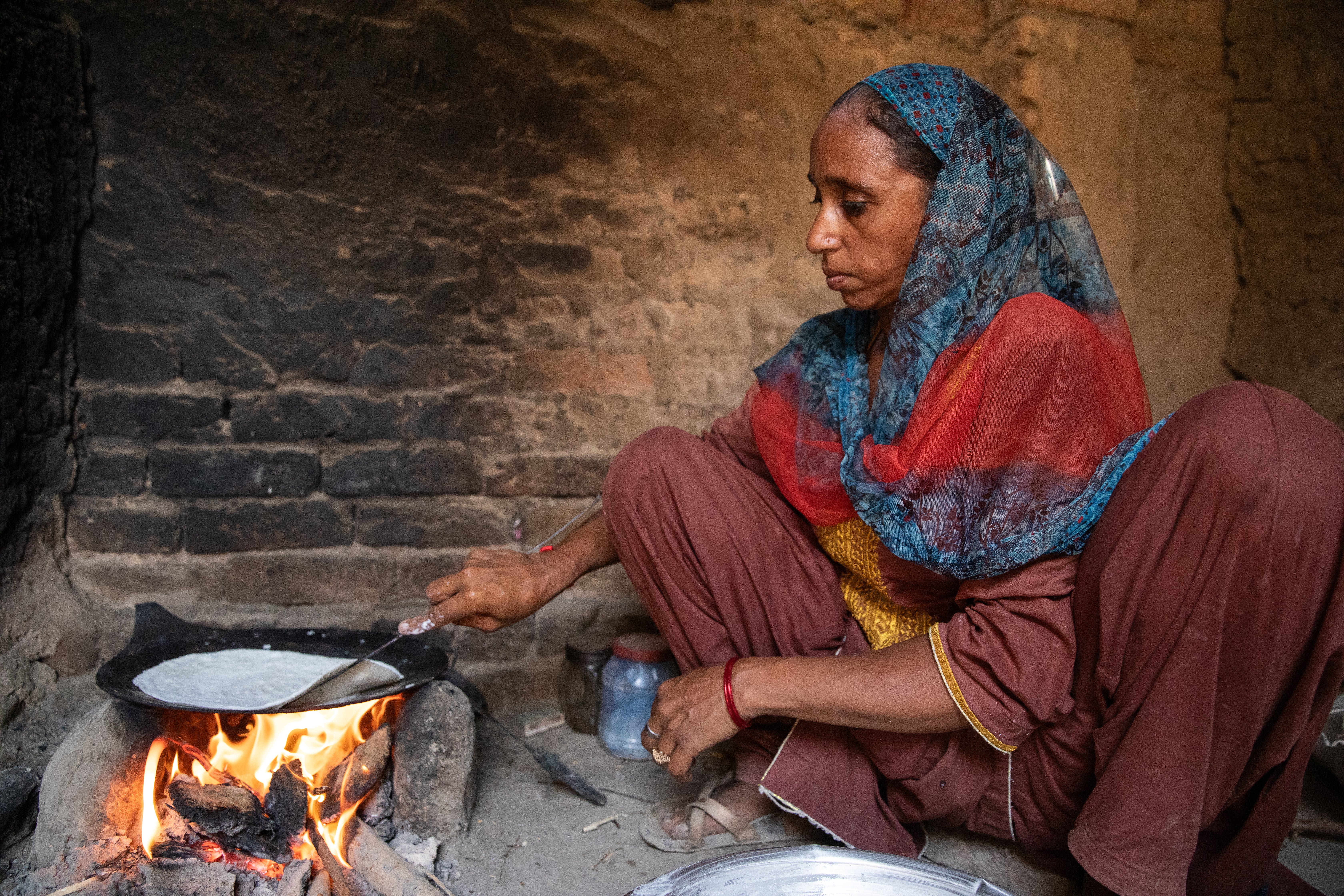 Zain’s mother Sughra, 35, is pictured making flatbreads in the family’s home