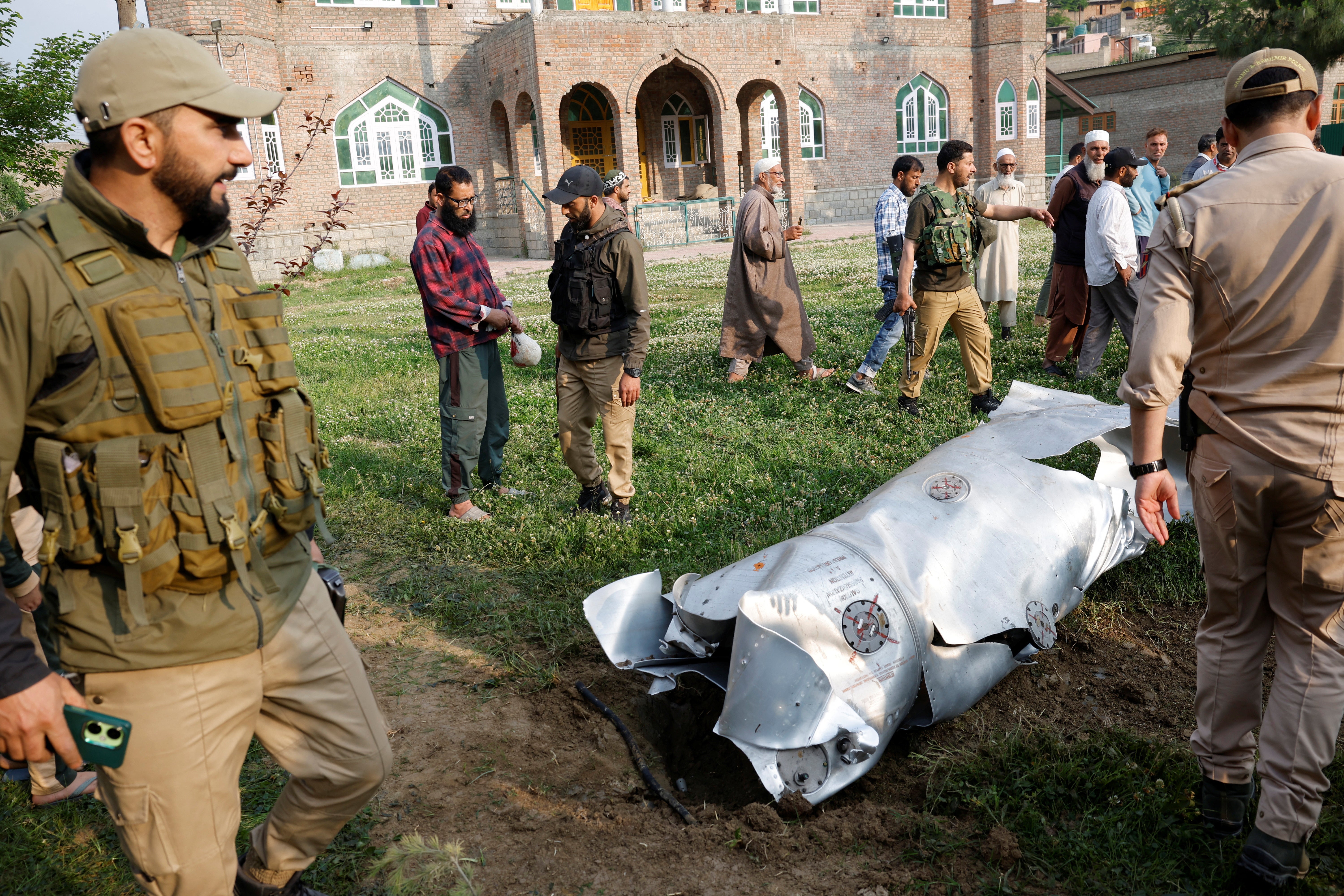 Metal debris lies on the ground in Wuyan in south Kashmir's Pulwama district