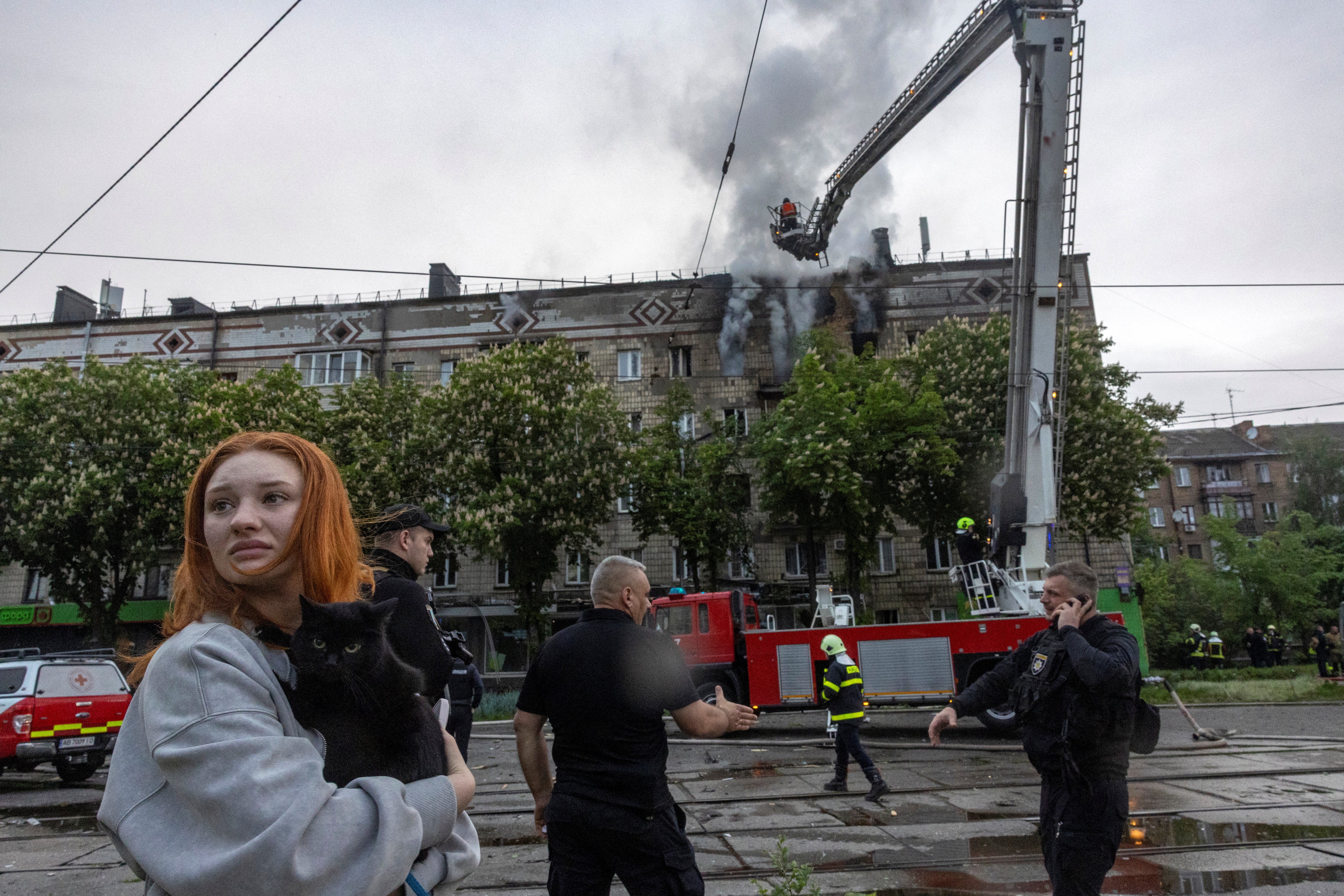Smoke billows from an apartment building hit by a Russian drone in Kyiv, Ukraine, on 7 May 2025