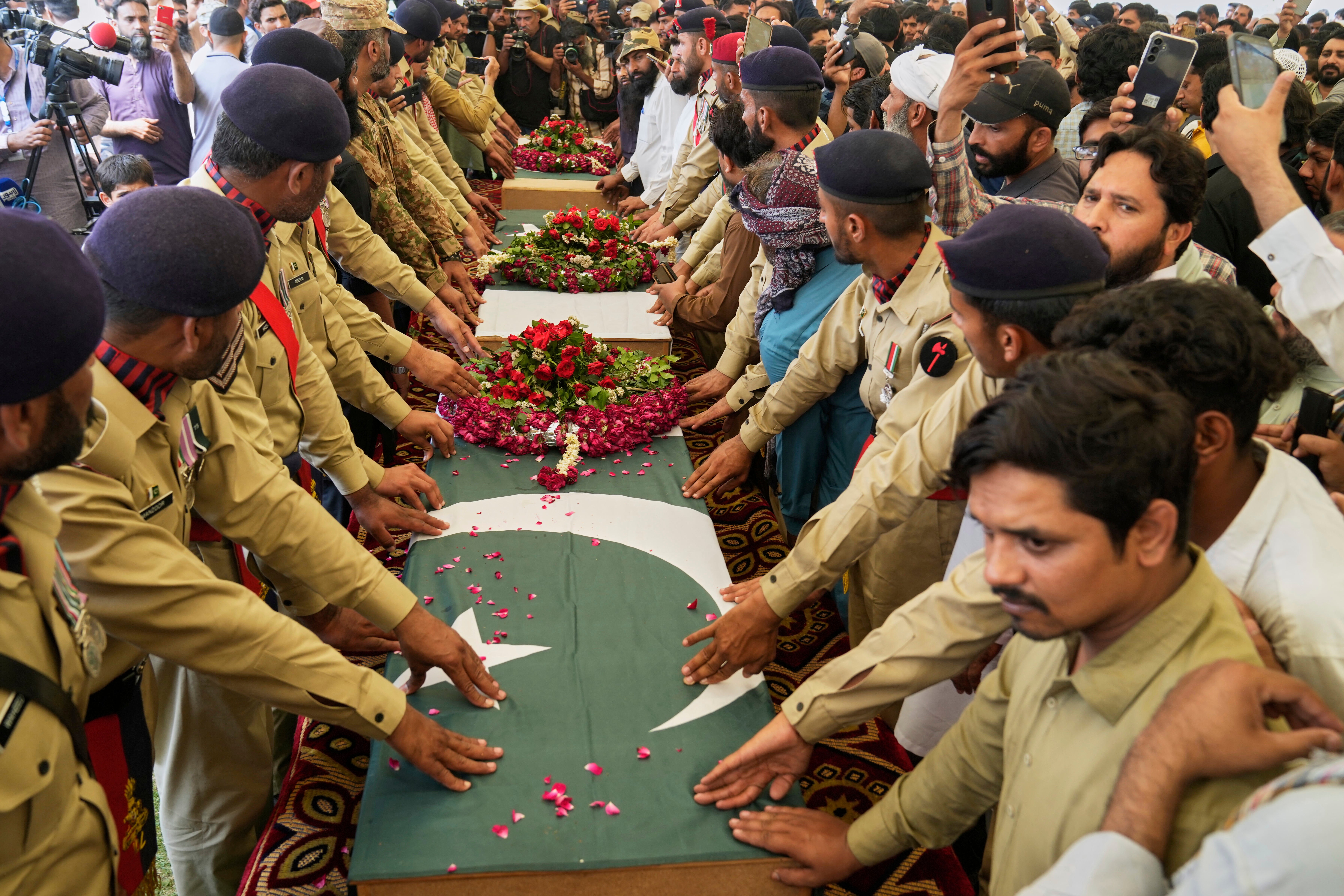 Pakistani soldiers attend funeral prayers for the victims of an Indian missile strike in Muridke, a town in Pakistan’s Punjab province, on Wednesday