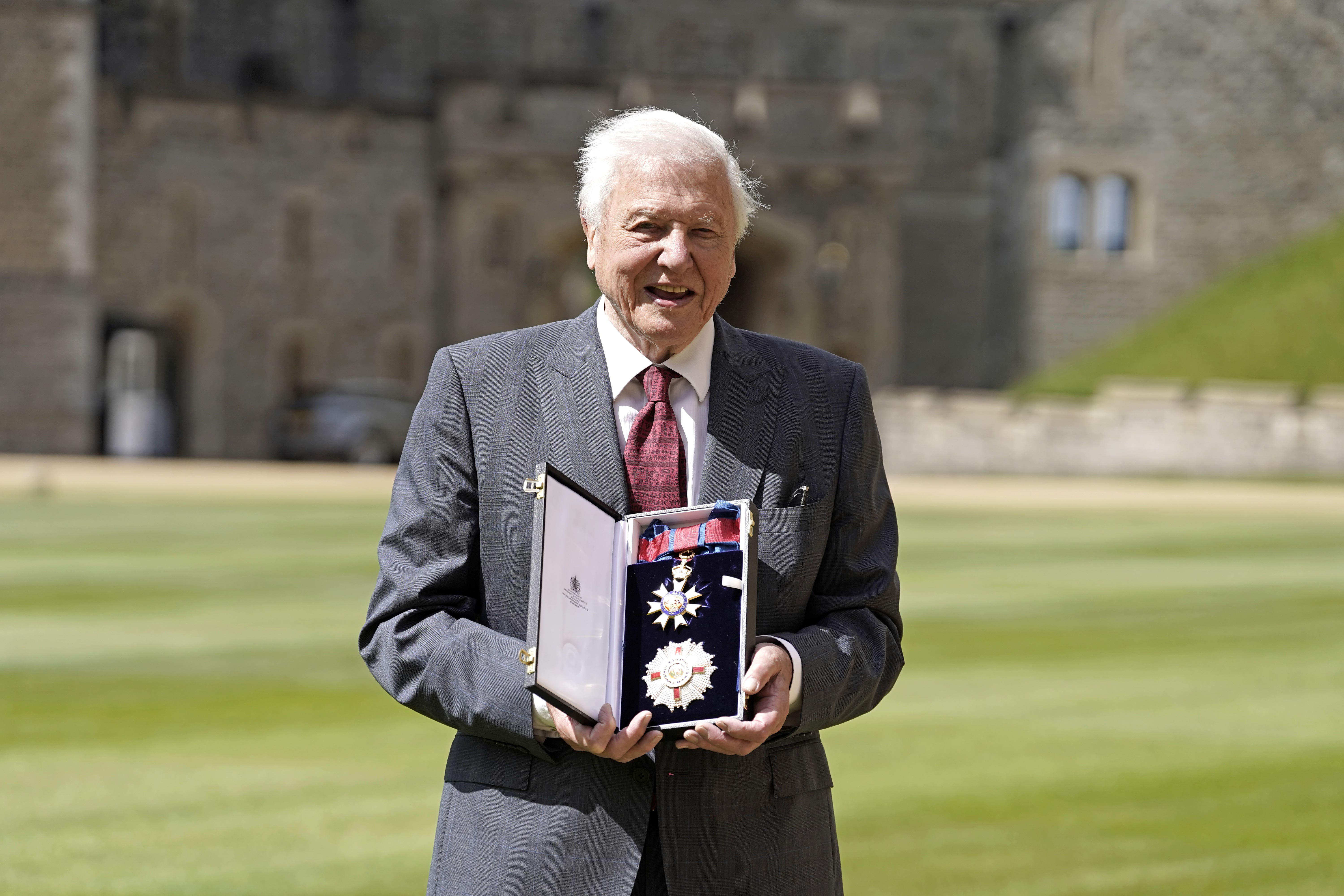 Sir David Attenborough after being appointed a Knight Grand Cross of the Order of St Michael and St George following an investiture ceremony at Windsor Castle (Andrew Matthews/PA)