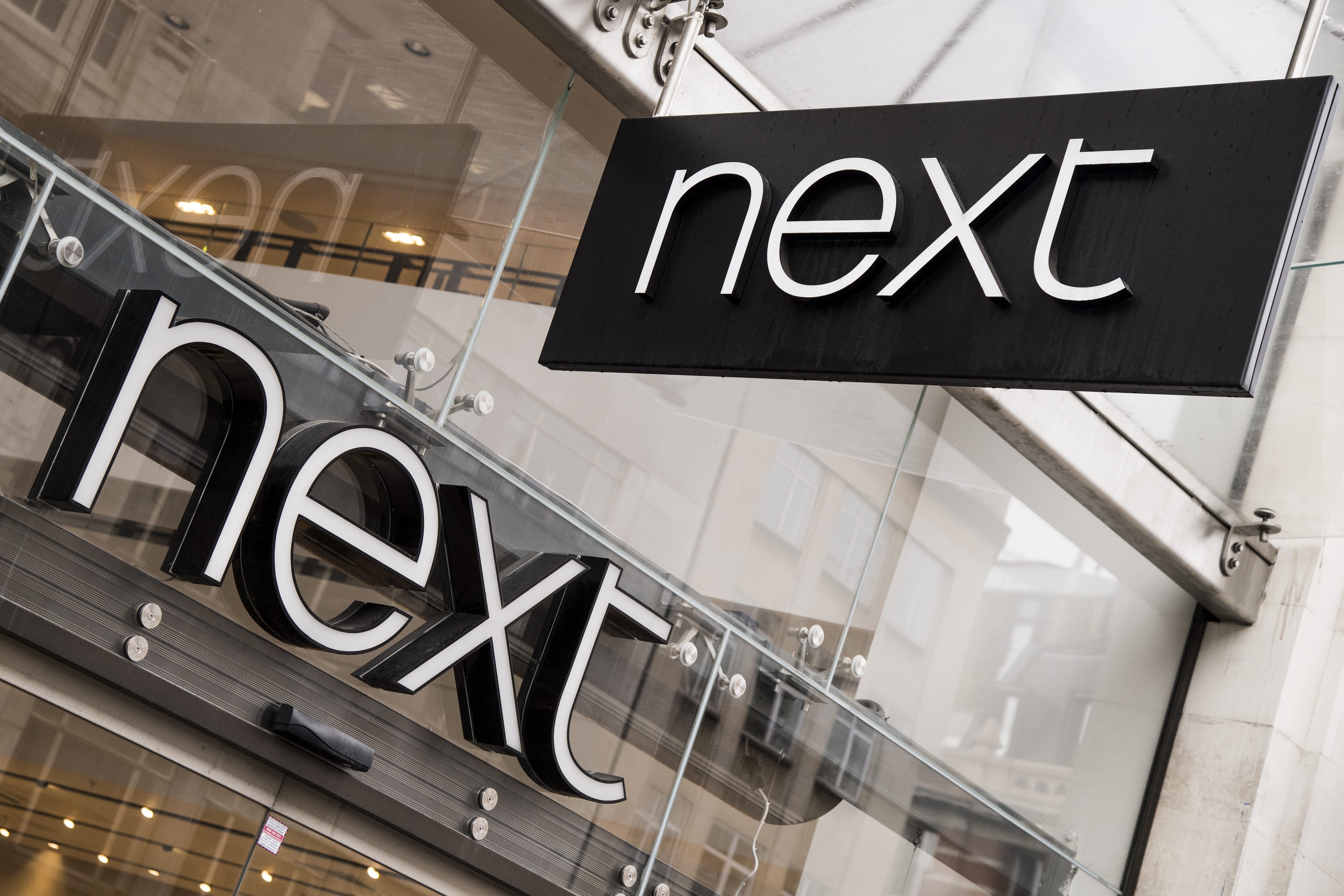 Warm spring weather has helped retailer Next raise its full-year guidance once again after giving a boost to summer clothing sales (Ian West/PA)