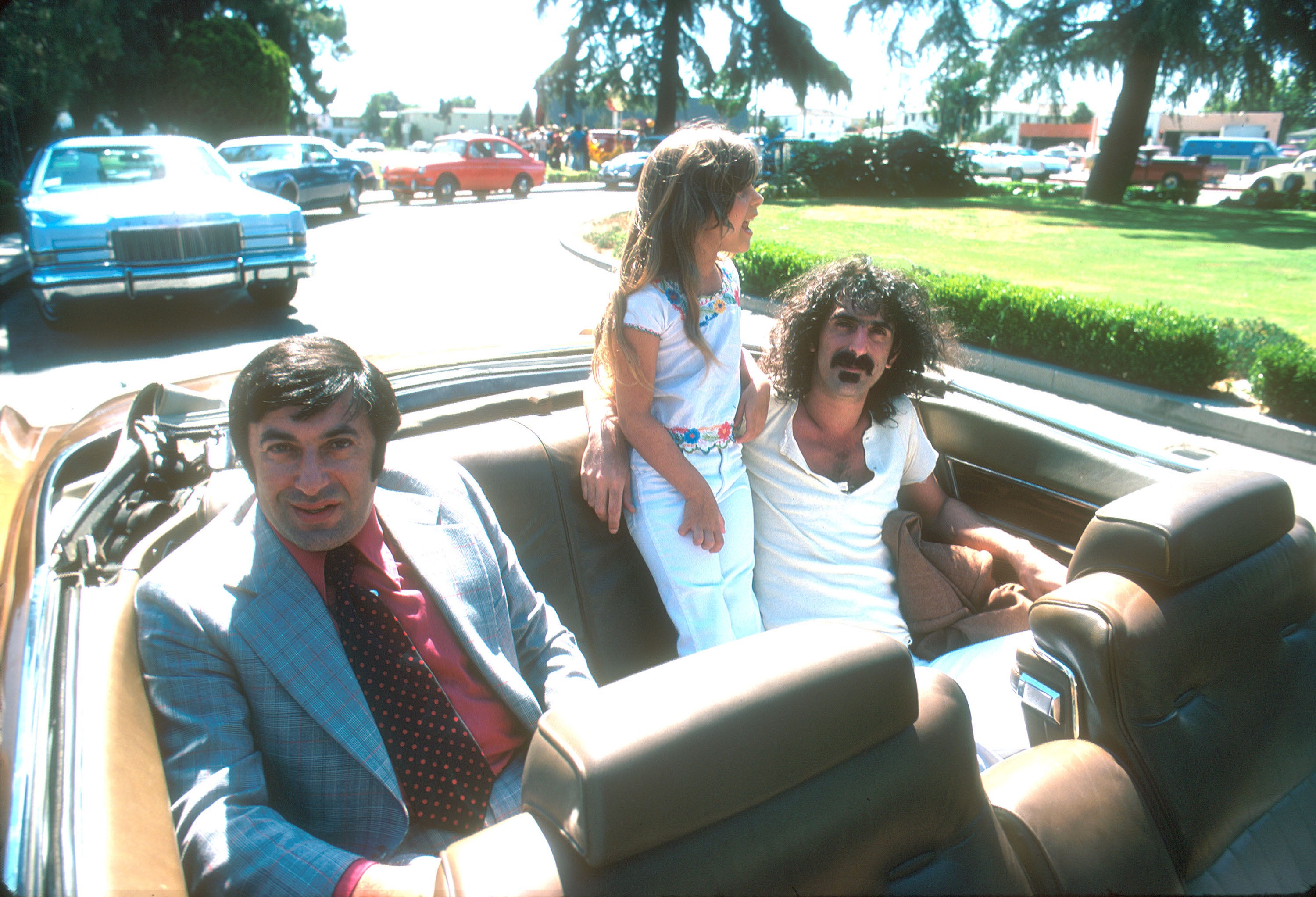  Frank Zappa and daughter Moon Unit outside Warner Bros. Records in Burbank, California