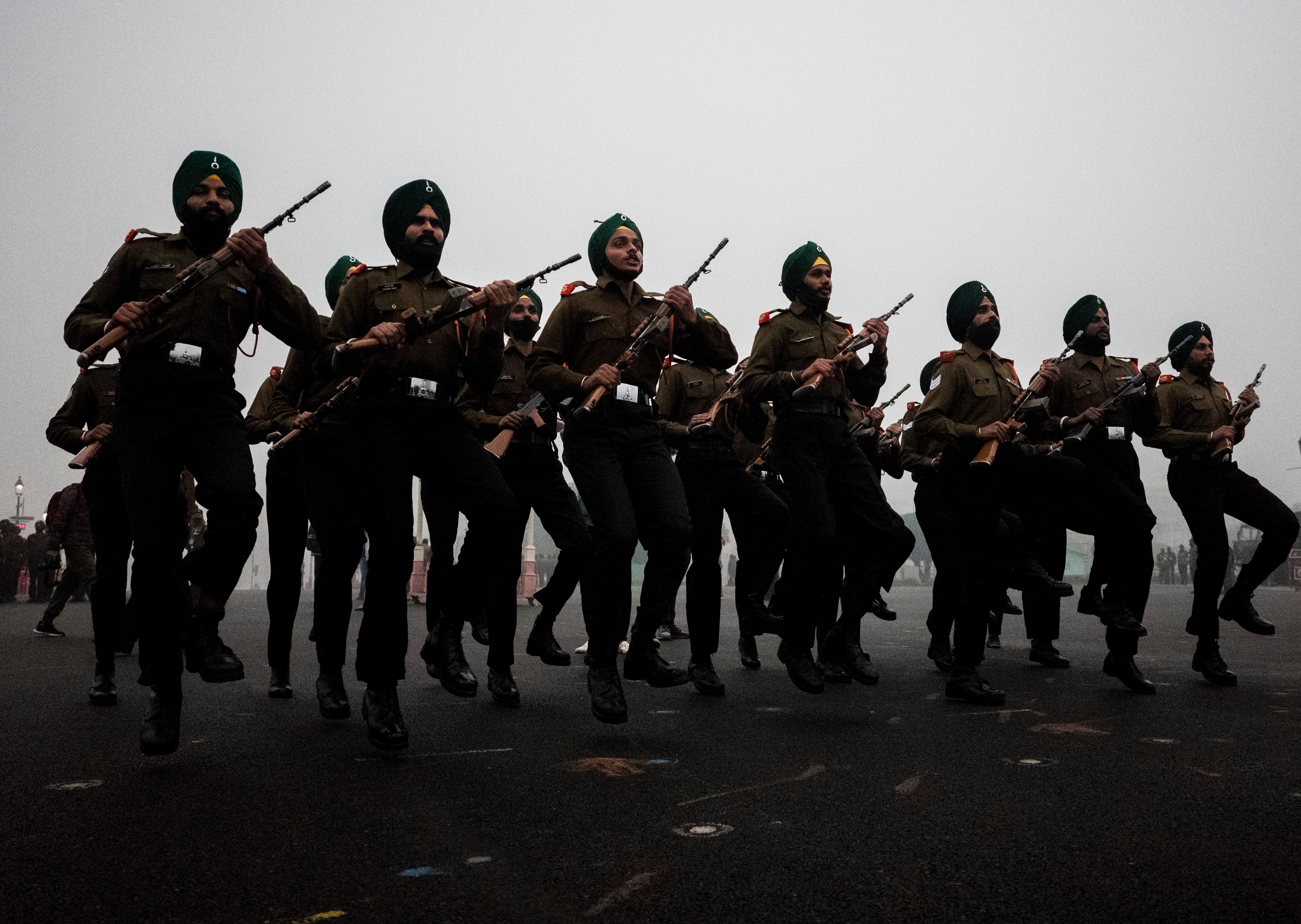 Indian soldiers rehearse ahead of the Republic Day parade at Rajpath in New Delhi