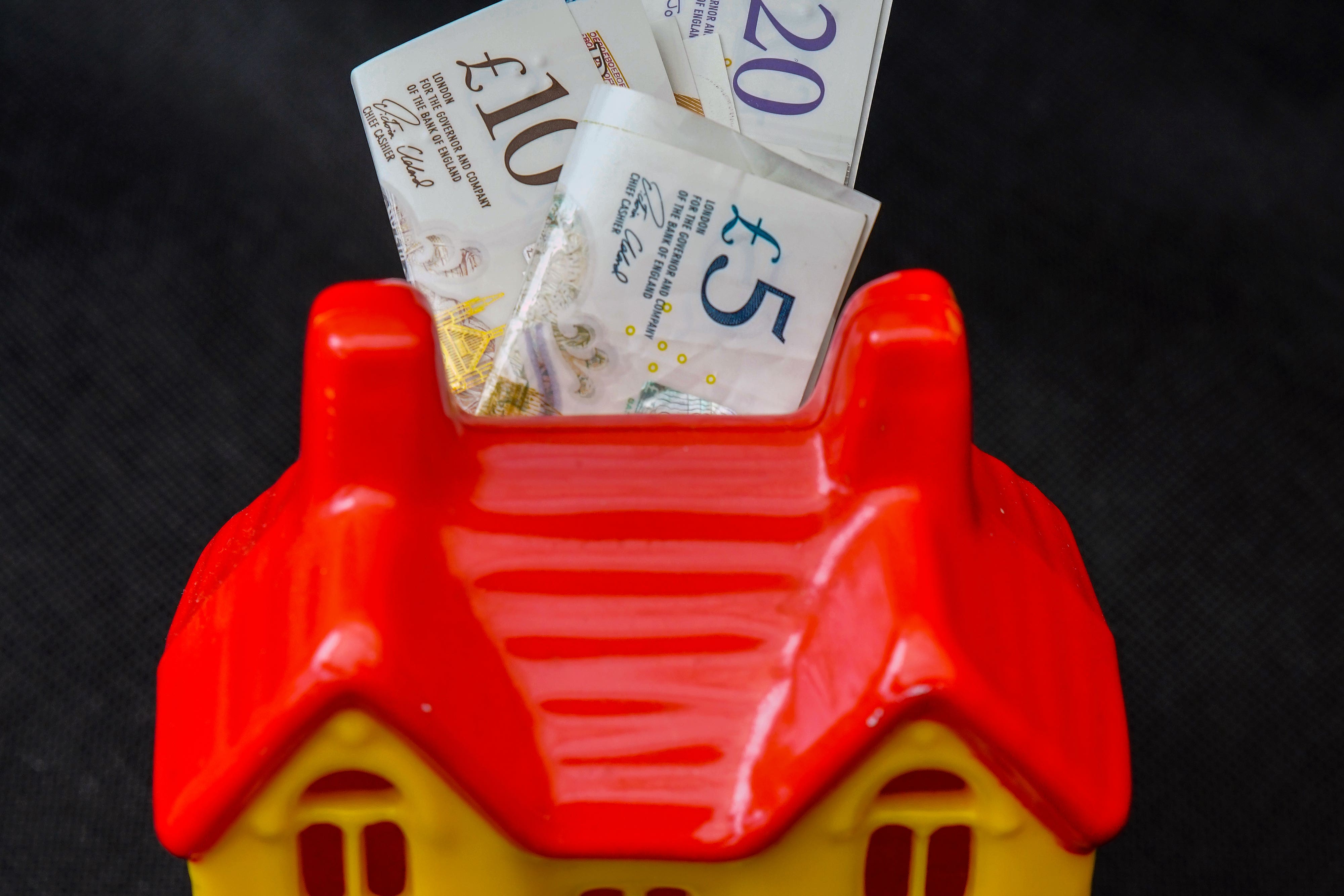 UK Finance said homeowners on tracker deals would typically see their monthly repayments reduce by £28.97 following the Bank of England’s base rate cut on Thursday (Peter Byrne/PA)