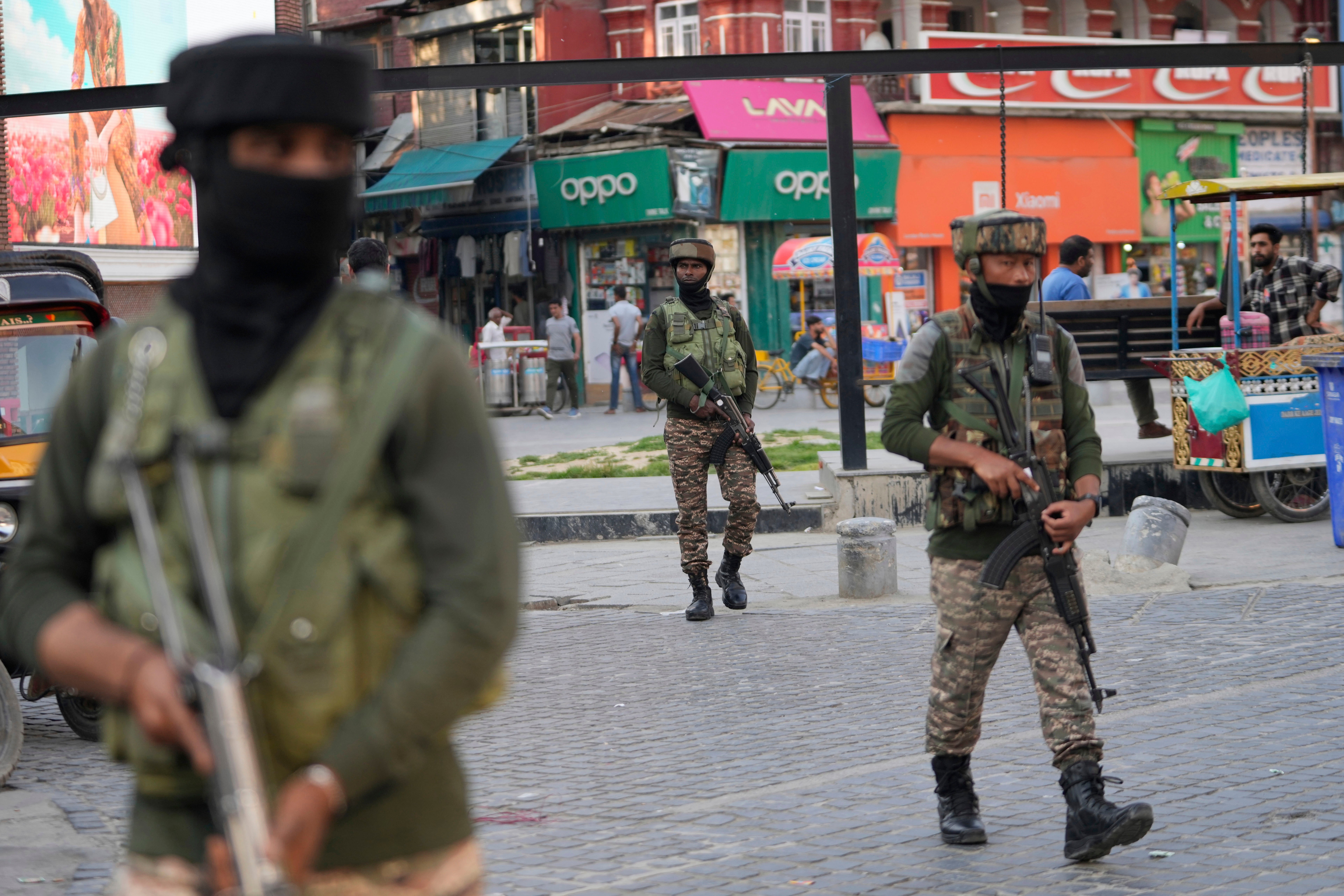 Indian soldiers guard at a market in Srinagar, Indian-controlled Kashmir