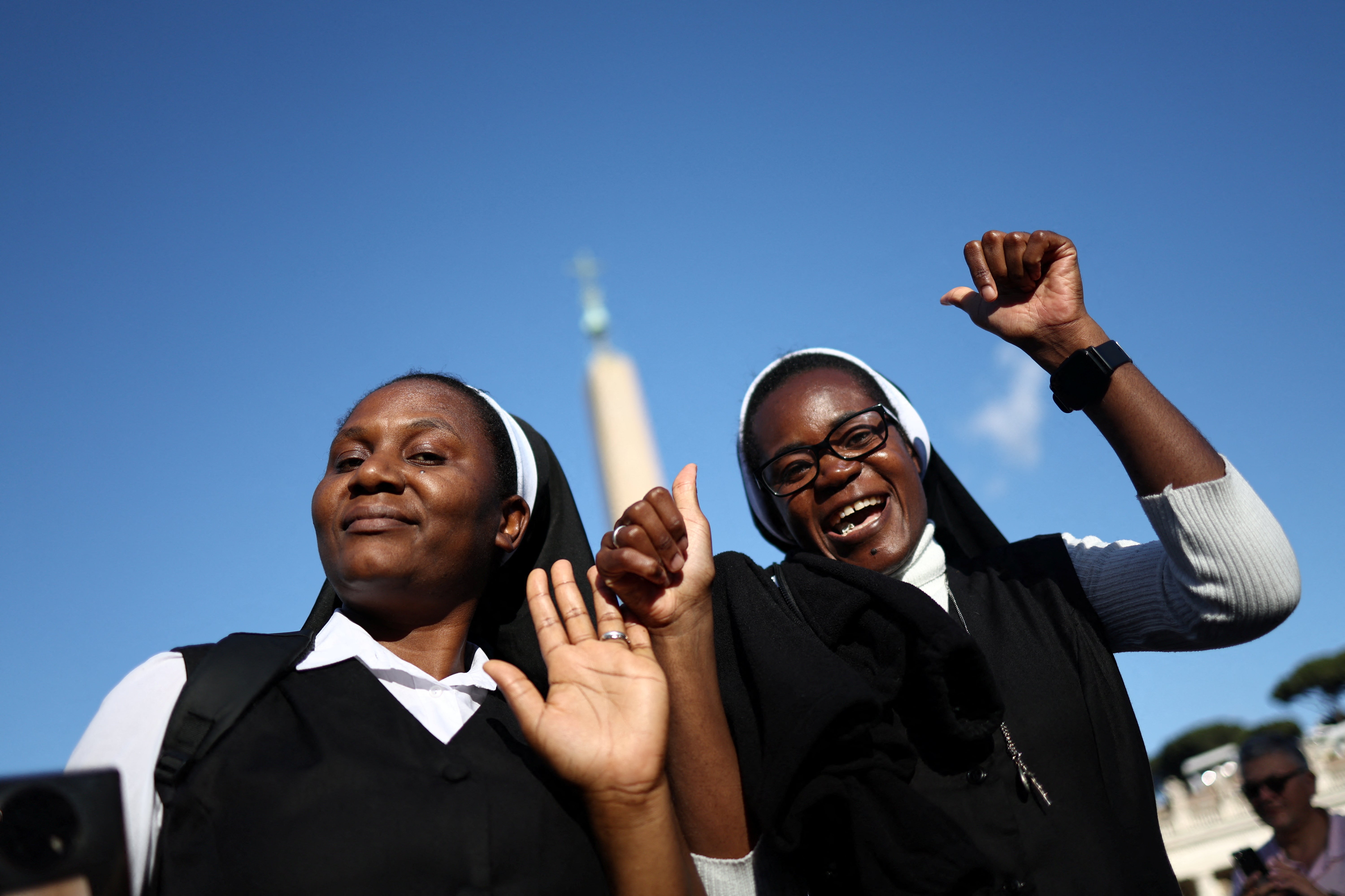 Nuns celebrate after white smoke was seen coming from the Sistine Chapel, signalling that a new pope had been elected