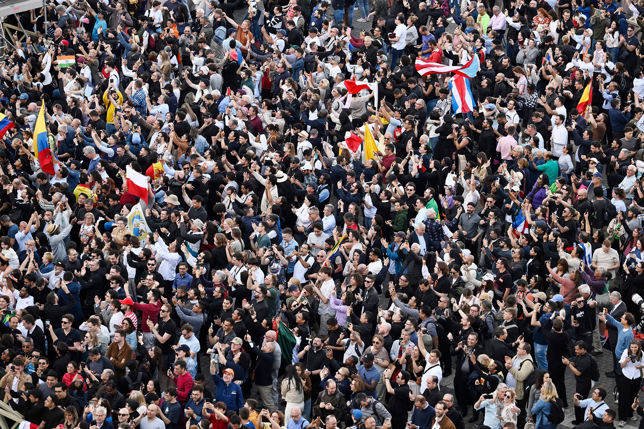 Large crowds celebrate on St Peter’s Square as they witness white smoke after a new pope is elected