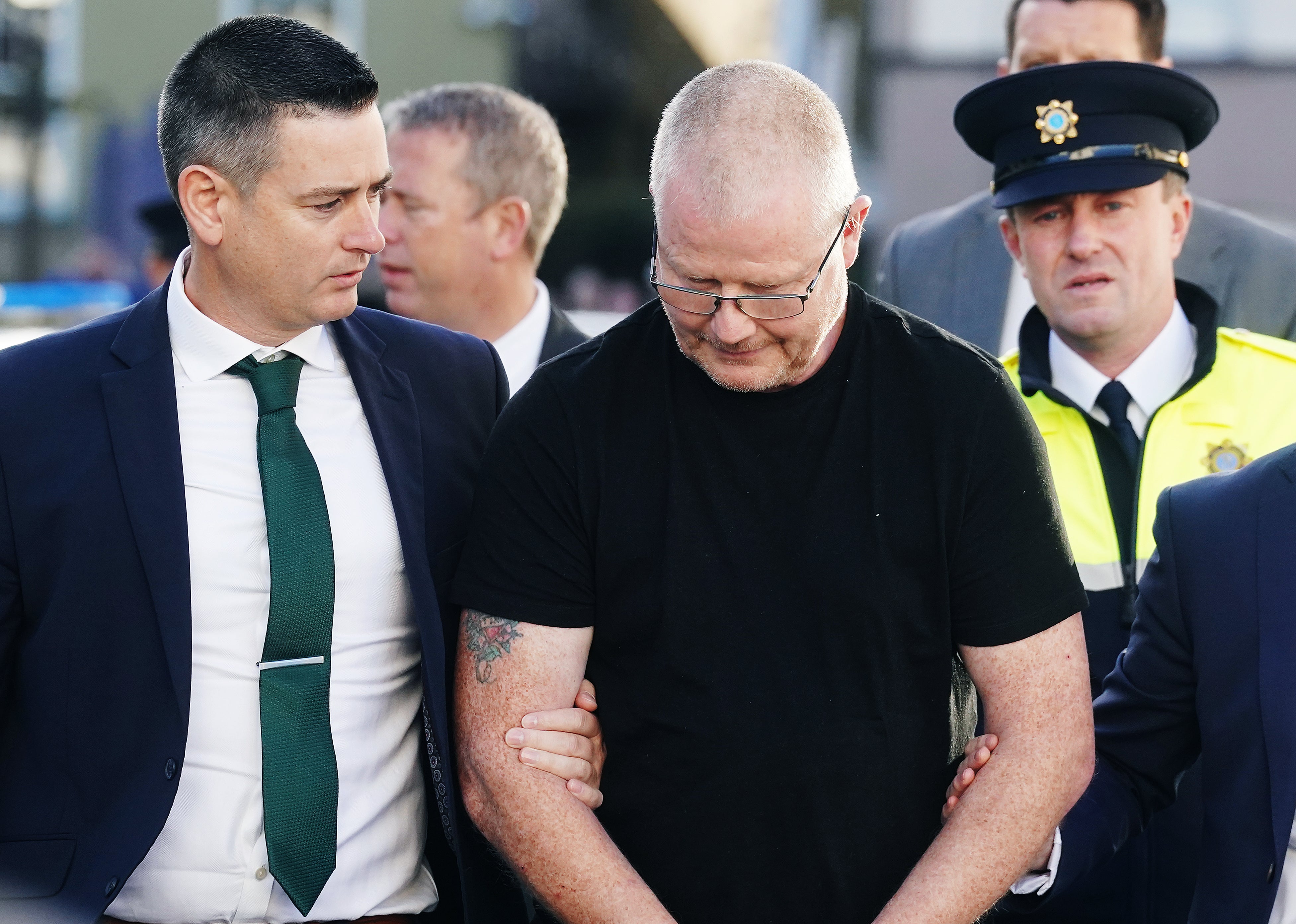 Richard Satchwell (centre) arriving at the District Court in Cashel, Co Tipperary, after being charged in connection with the murder of his wife Tina Satchwell