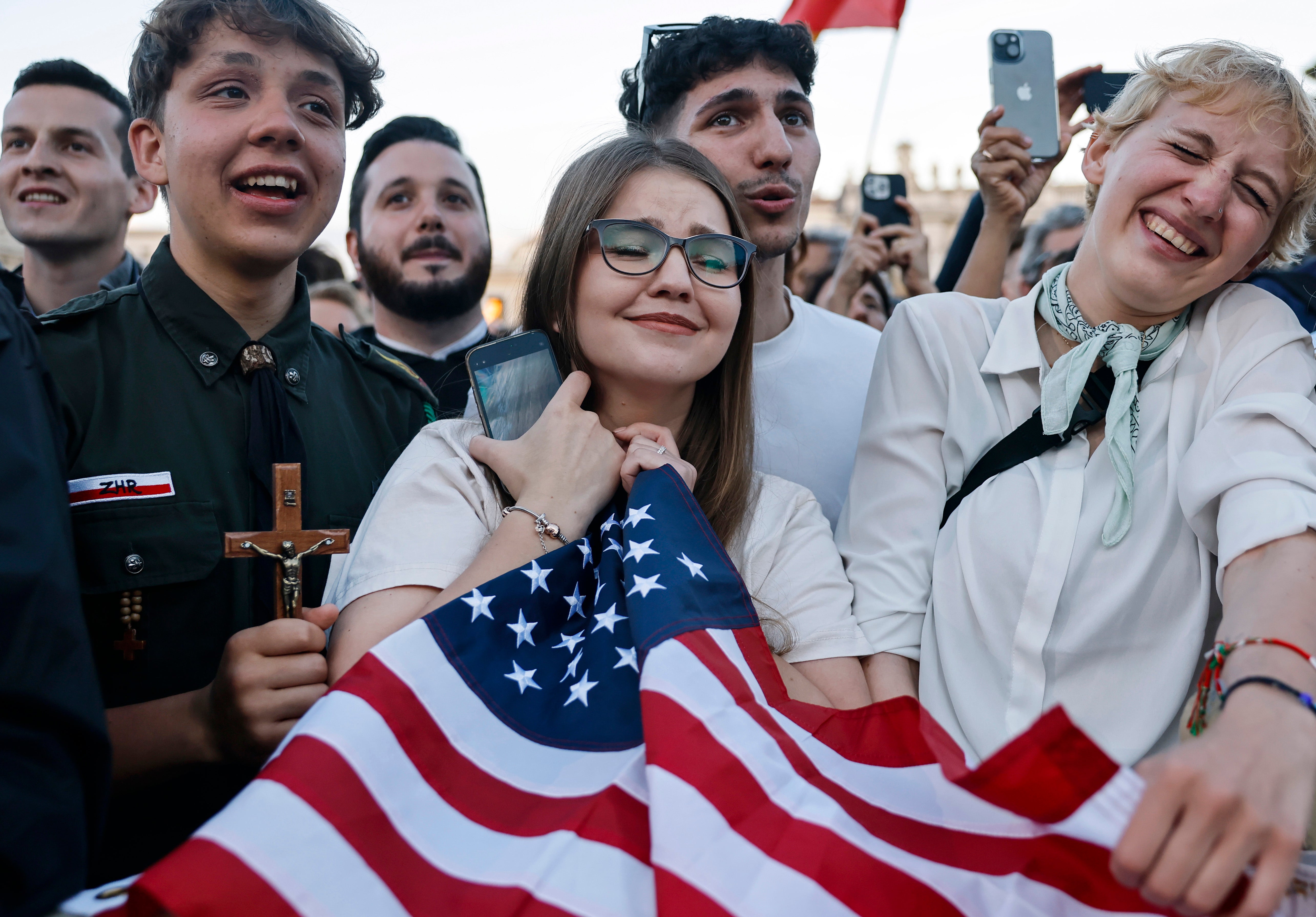 Faithful Catholics cheered in the Vatican square, waved flags from countless countries in celebration as the news of the new pope was shared.