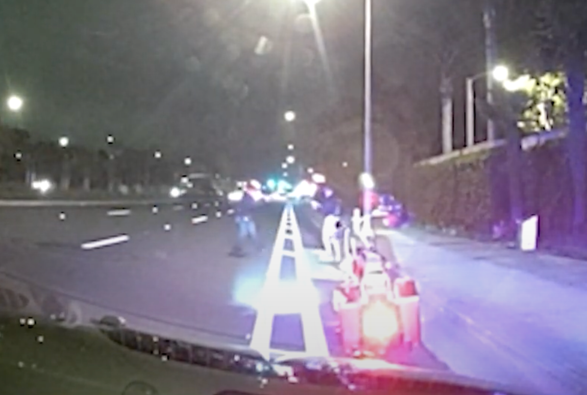 The officer can be seen drawing and pointing his weapon at Stirling as he called for the victim to 'drop' the taser