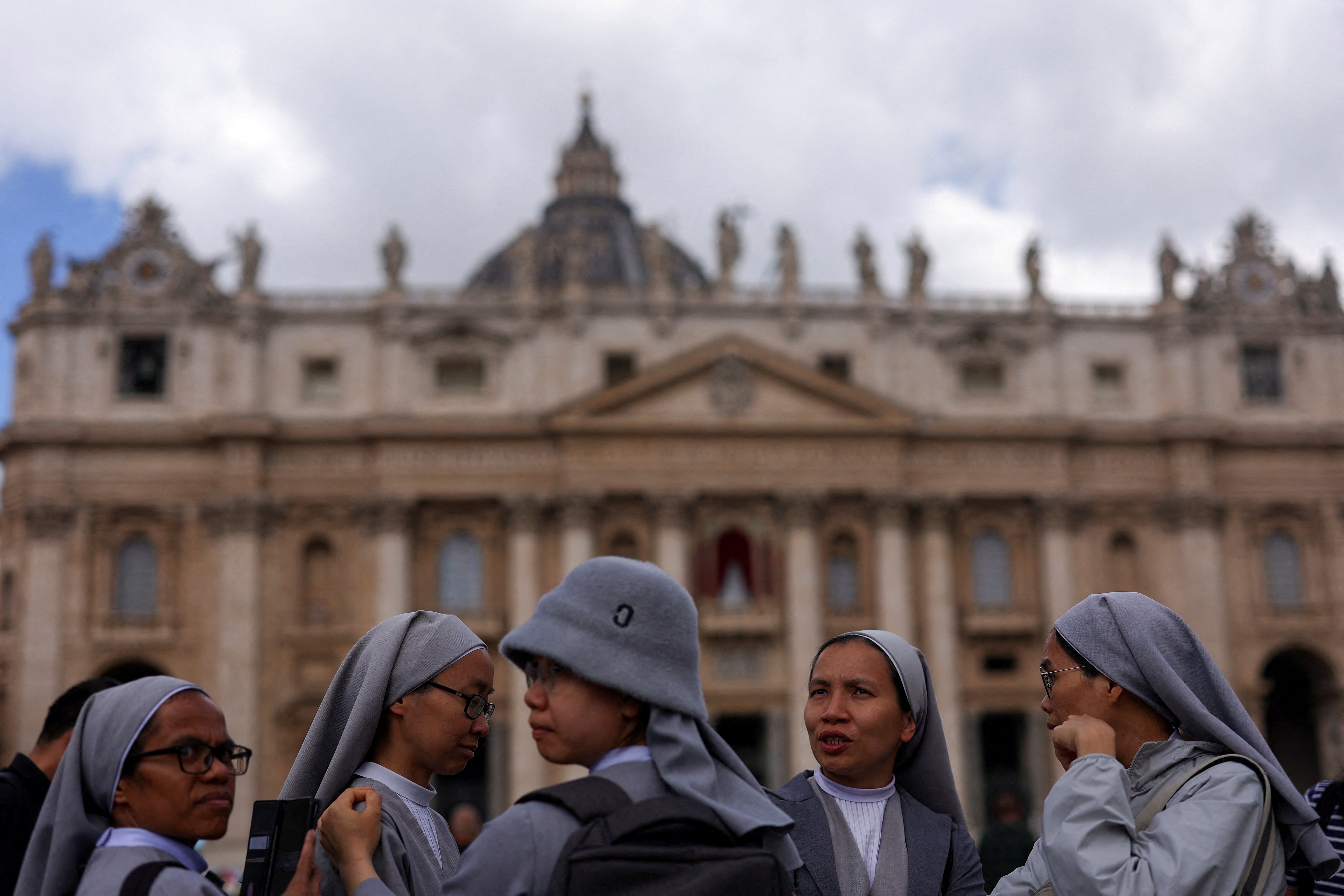 Nuns wait at St Peter's Square on the second day of the conclave