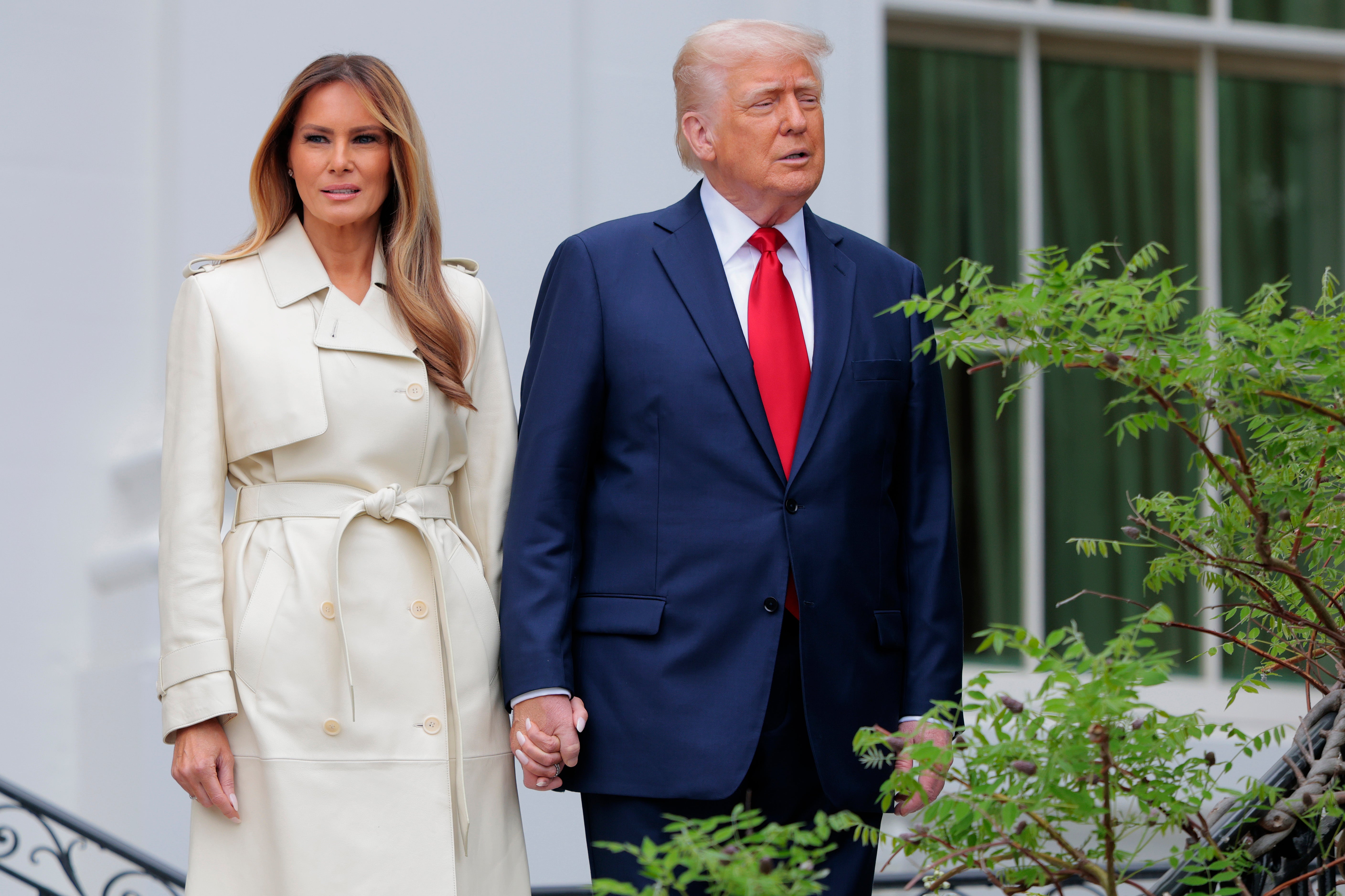 Melania Trump, pictured beside her husband, President Donald Trump, last month, has stayed fewer than 14 days at the White House, sources say