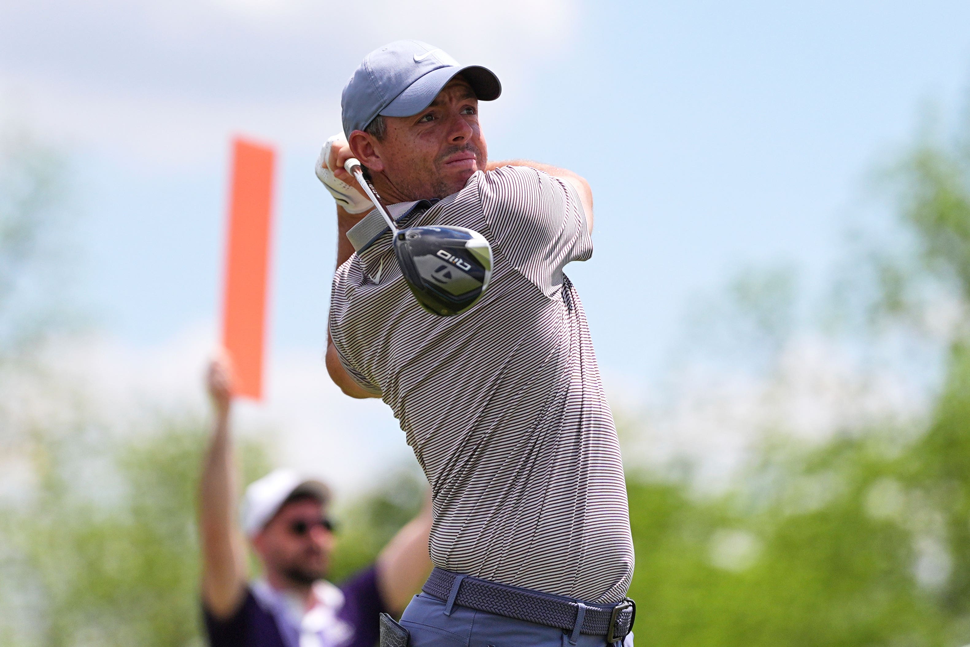 Rory McIlroy hits on the fourth hole during the first round of the Truist Championship (Matt Rourke/AP)